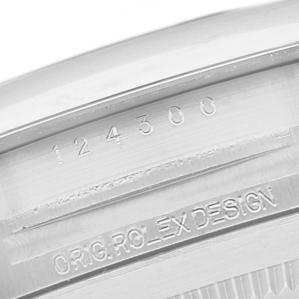 This is a close-up angle of the serial and design inscriptions on the case back of a Rolex Oyster Perpetual 124300 Men
s Stainless Steel Black Dial 124300 Men
s Stainless Steel Black Dial model watch.