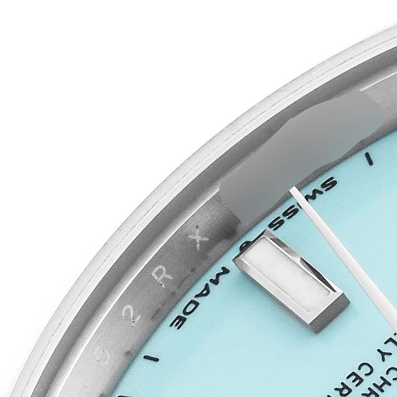 This close-up shows a portion of the dial and markers of the Mid-Size Rolex watch.