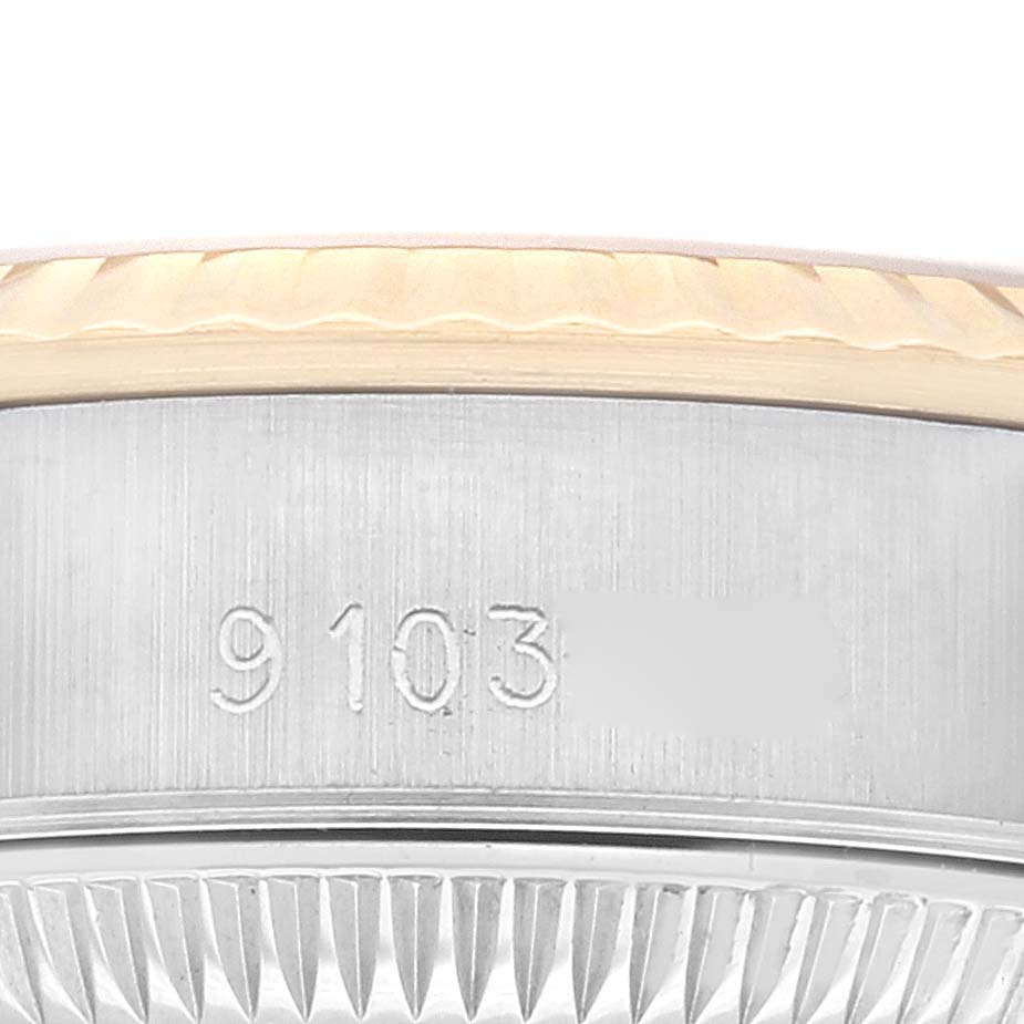 The image shows a close-up of the serial number on the side of a Rolex Oyster Perpetual 67193 Women's Steel and Gold (two tone) Silver Dial 67193 Women's Steel and Gold (two tone) Silver Dial watch case.