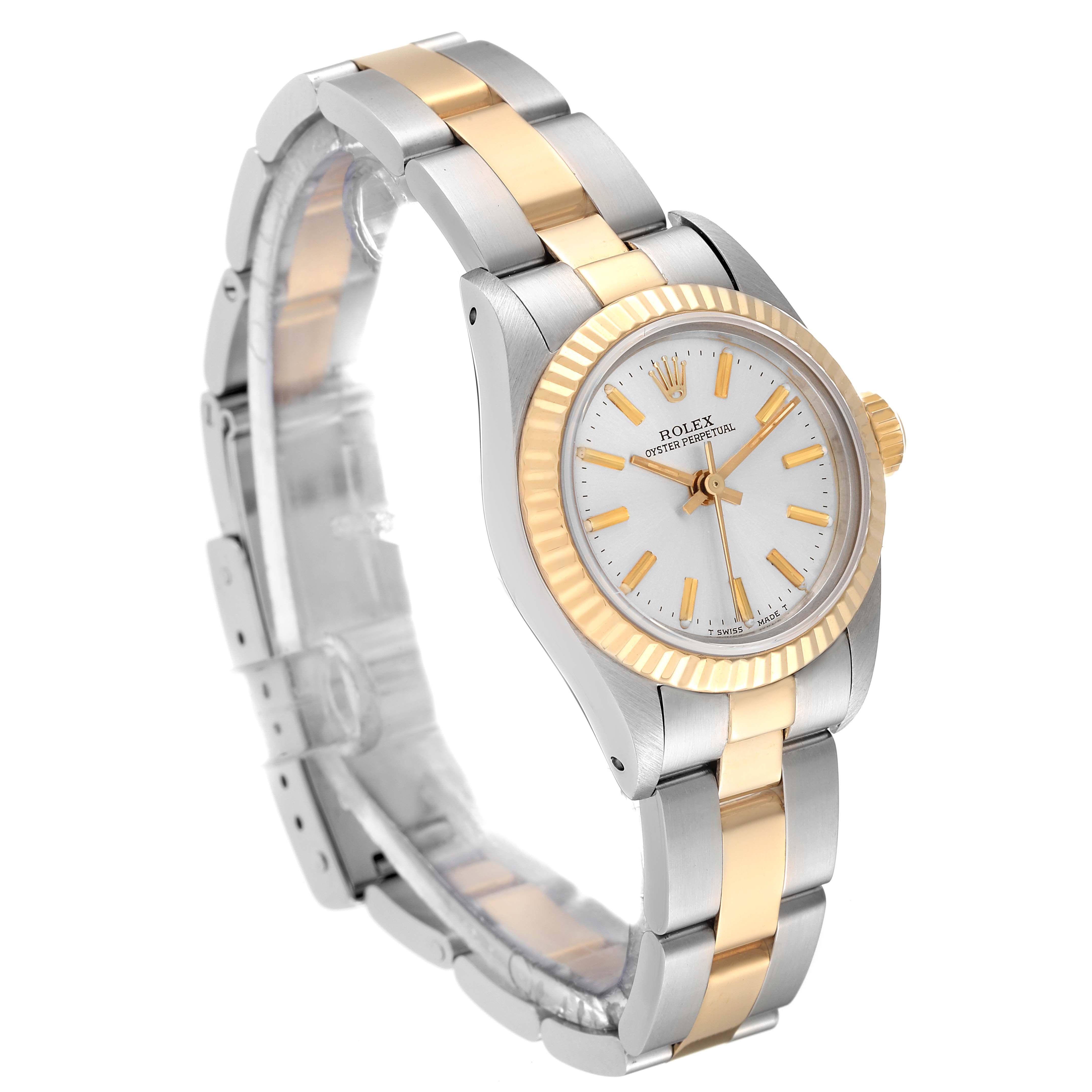 The Rolex Oyster Perpetual 67193 Women's Steel and Gold (two tone) Silver Dial 67193 Women's Steel and Gold (two tone) Silver Dial watch is shown at an angled side view highlighting its dual-tone band and face.