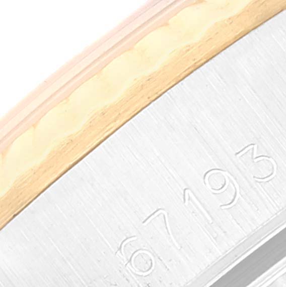 This image shows a close-up of the side part of a Rolex Oyster Perpetual 67193 Women's Steel and Gold (two tone) Silver Dial 67193 Women's Steel and Gold (two tone) Silver Dial watch, highlighting the model number "67193."