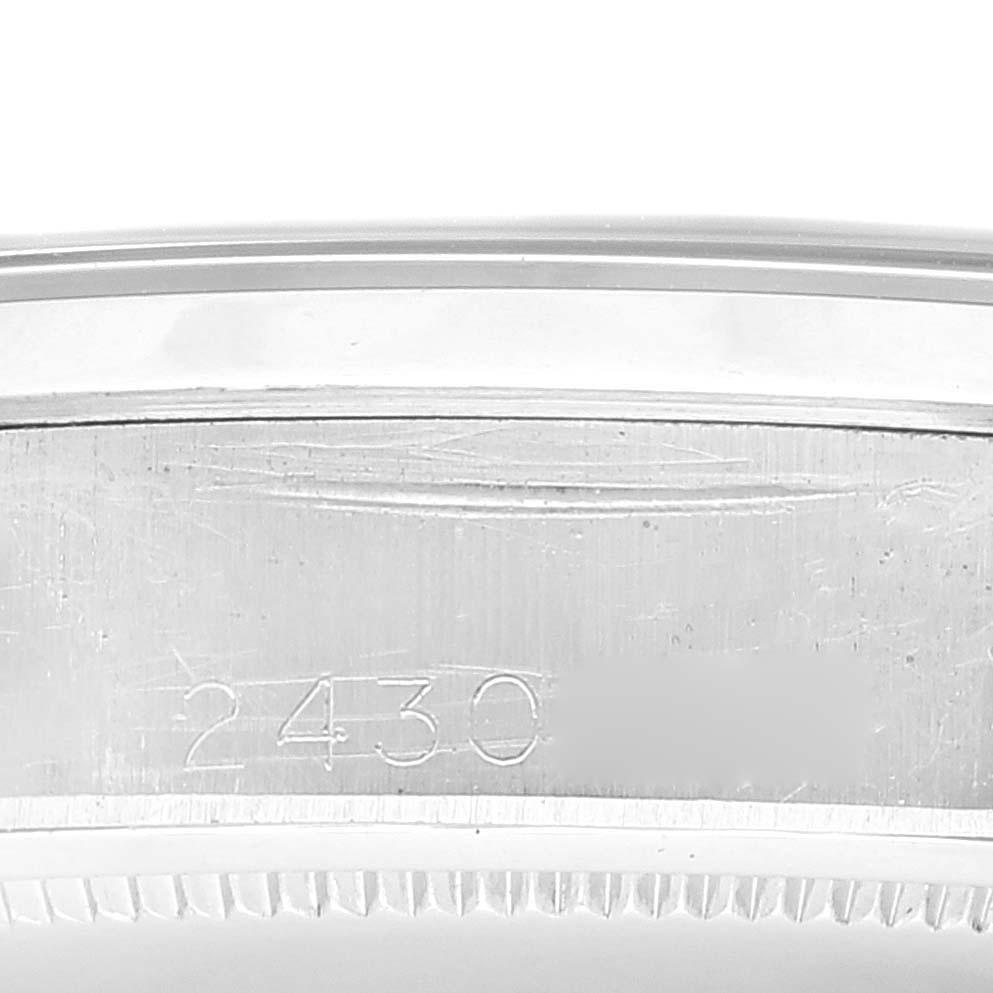 The image shows the side of the case of a Rolex Vintage Collection 6694 Men's Stainless Steel Black Dial 6694 Men's Stainless Steel Black Dial watch with the model number "2430" engraved.