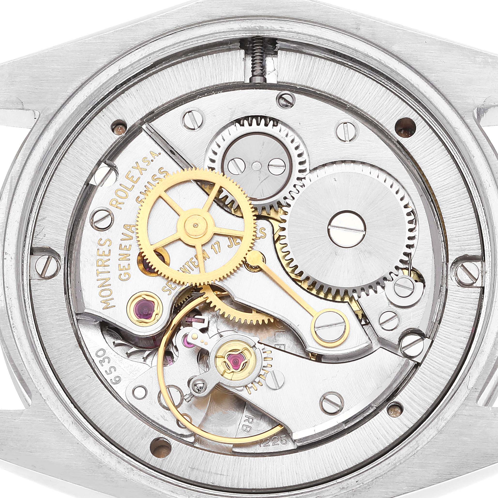 The image shows the internal mechanical movement of a Vintage Collection Rolex watch, viewed from the back.