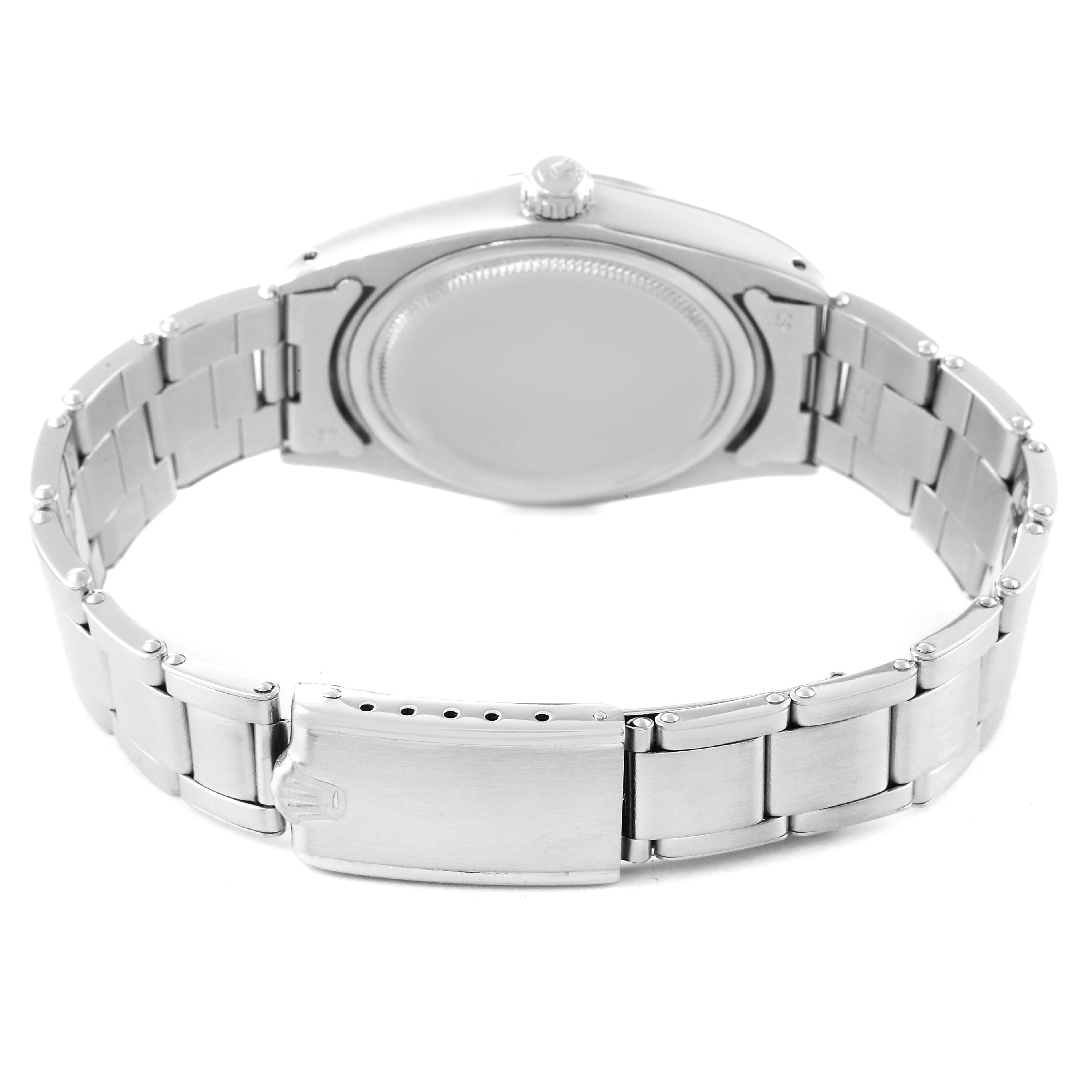 The image shows the back case and bracelet of a Vintage Collection model by Rolex, viewed from the rear.