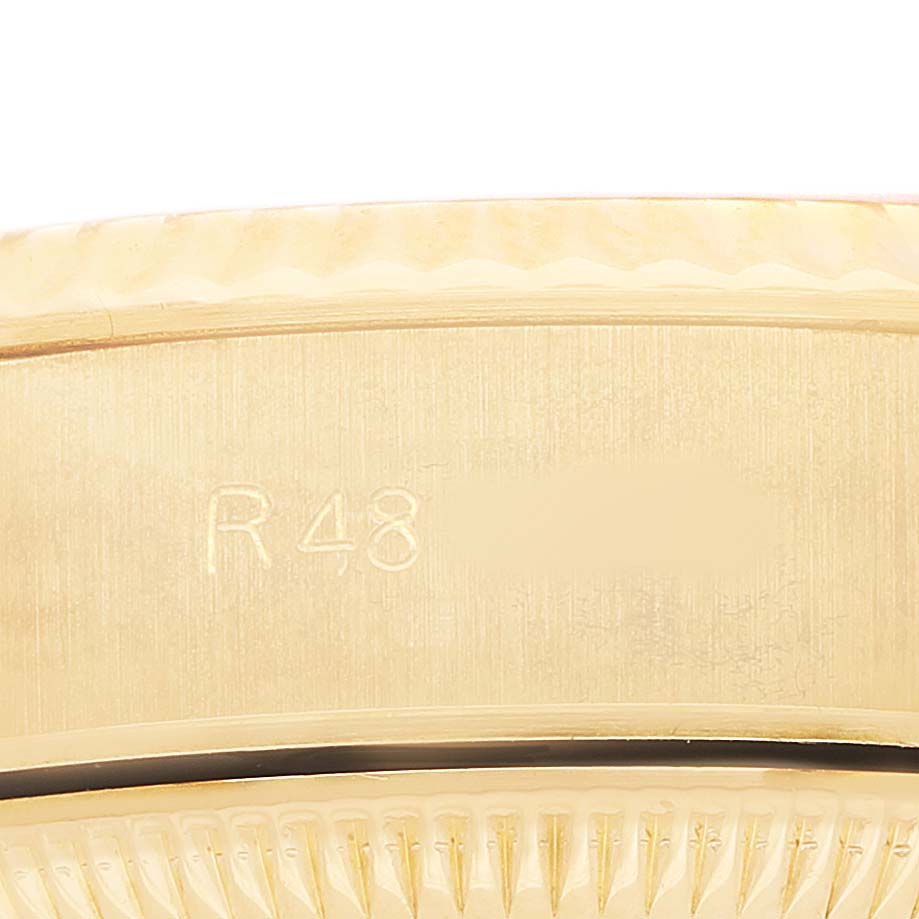 The image shows a close-up of the side of a Rolex President 69178 Women's Yellow Gold Champagne Dial model, focusing on the engraved details.