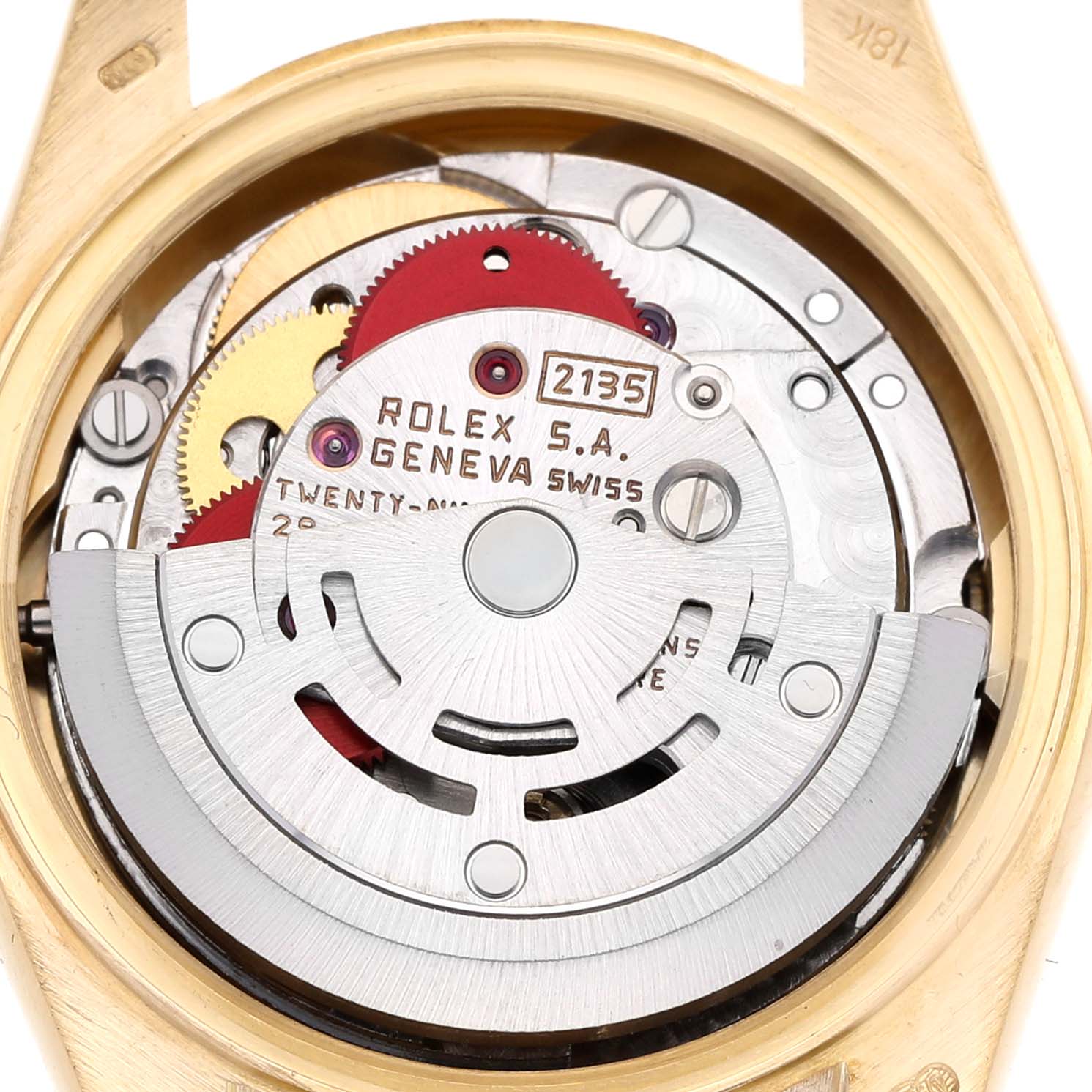 The image shows a close-up of the movement inside a Rolex President 69178 Women's Yellow Gold Champagne Dial watch, highlighting the gears and rotor.