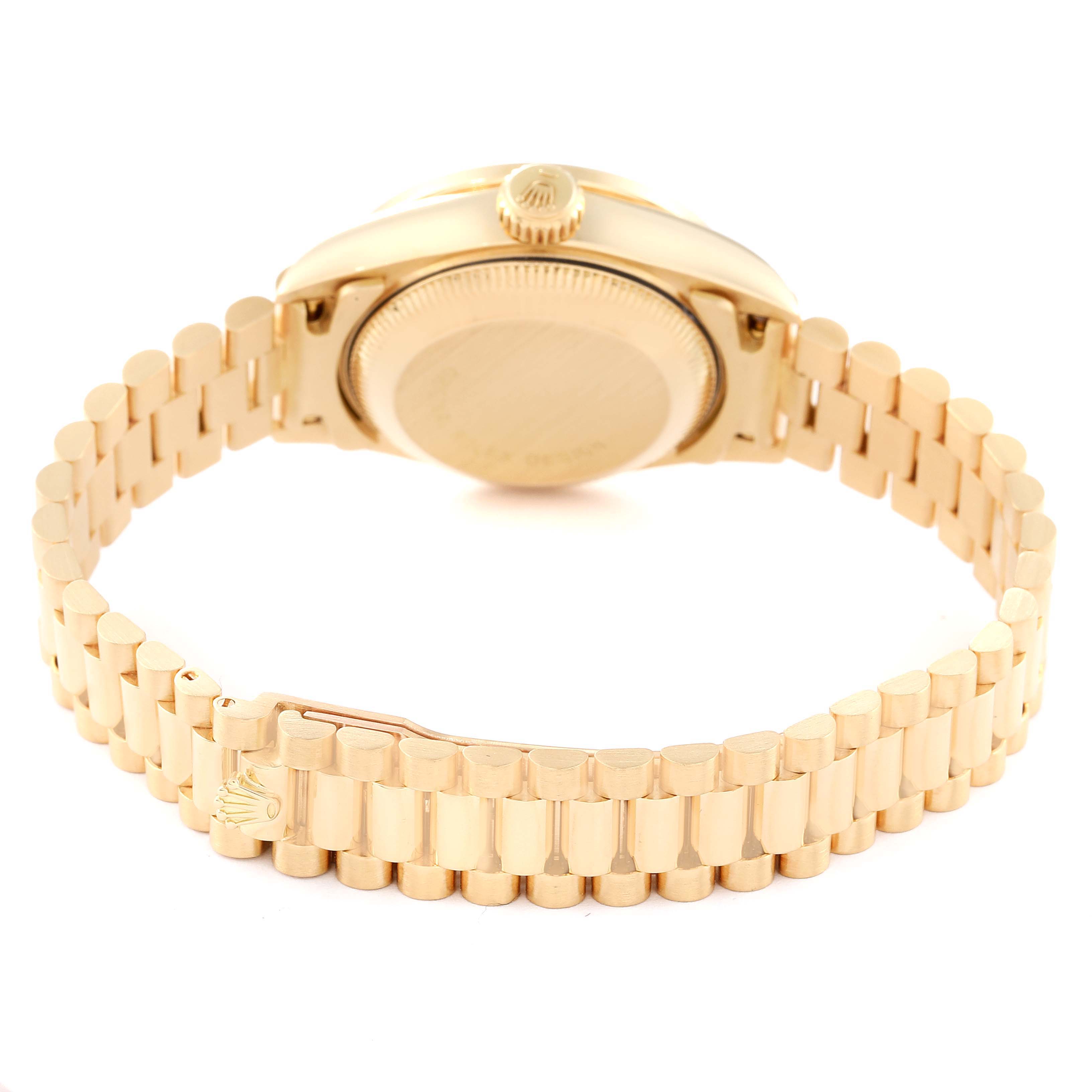 The image shows the back and bracelet of a gold Rolex President 69068 Women's Yellow Gold Champagne Dial 69068 Women's Yellow Gold Champagne Dial model watch.