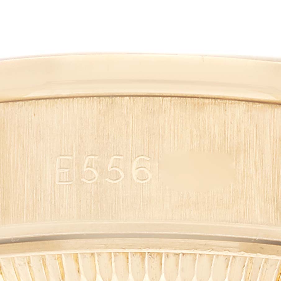 This image shows a close-up of the inside case back of a Rolex President 69068 Women's Yellow Gold Champagne Dial 69068 Women's Yellow Gold Champagne Dial model watch, focusing on its serial number.