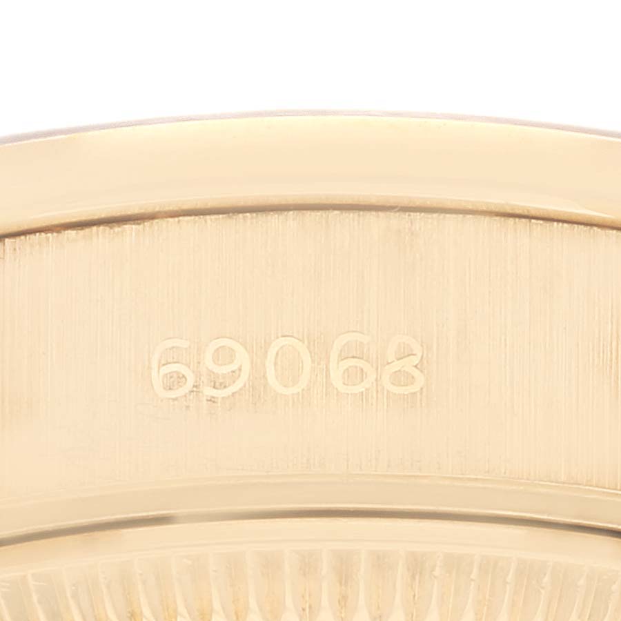 This close-up image displays the model number engraved on the back case of a Rolex President 69068 Women's Yellow Gold Champagne Dial 69068 Women's Yellow Gold Champagne Dial watch.