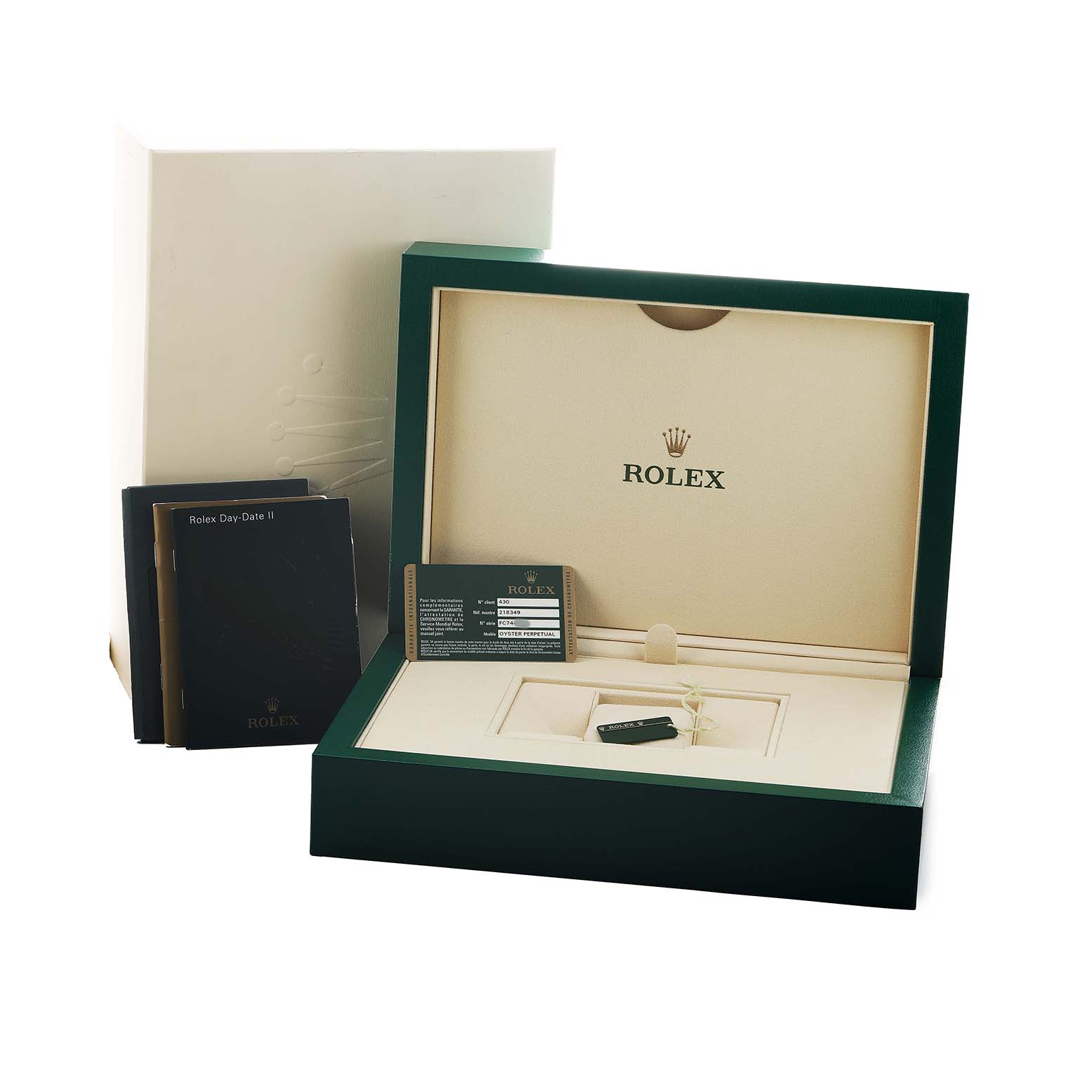 The image shows the packaging and accessories of a Rolex President 218349 Men's White Gold White Dial model, including the box, manuals, and a warranty card.