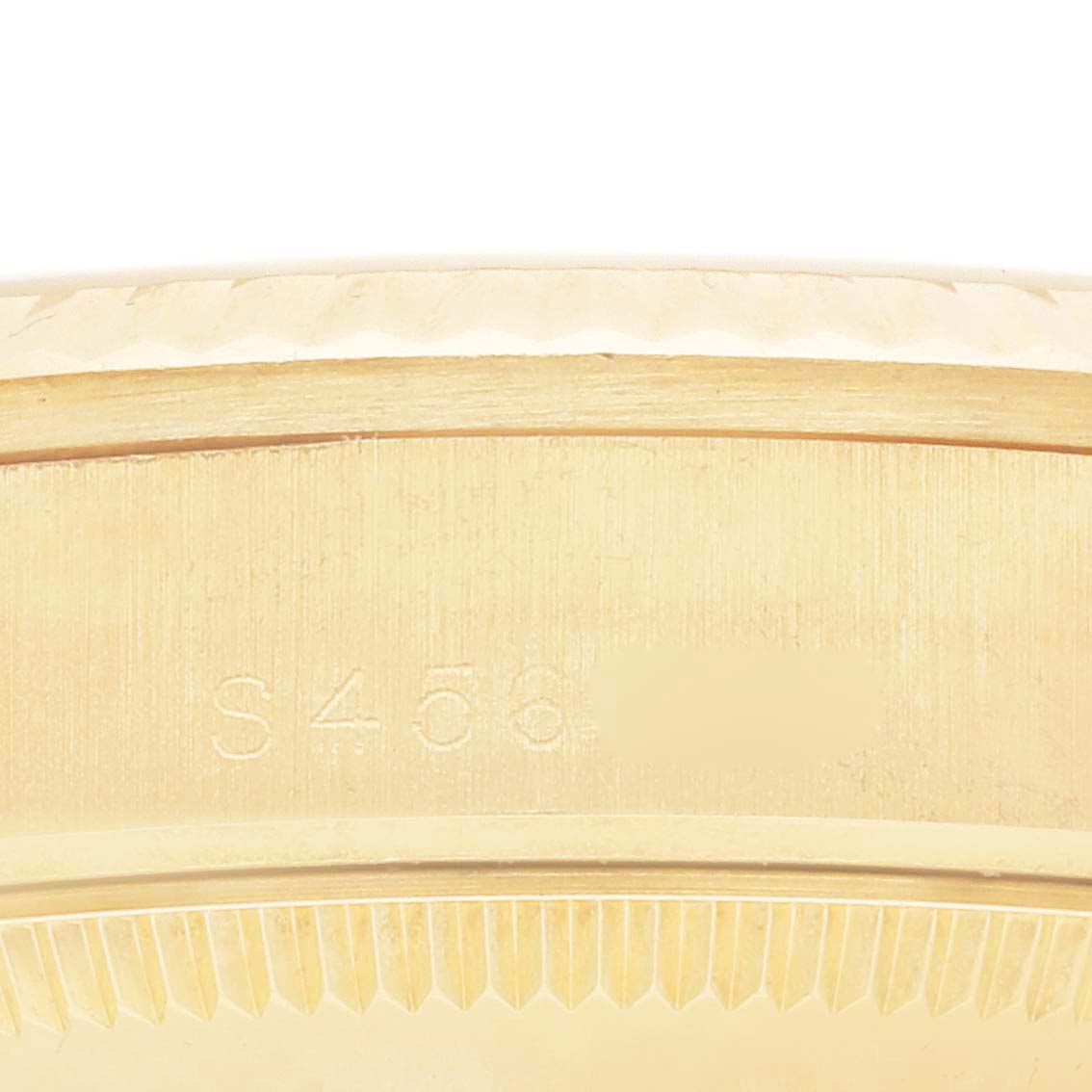This image shows a close-up of the side and edge of the bezel of a Rolex President 68278MR Women
s Yellow Gold Champagne Dial 68278MR Women
s Yellow Gold Champagne Dial model watch.