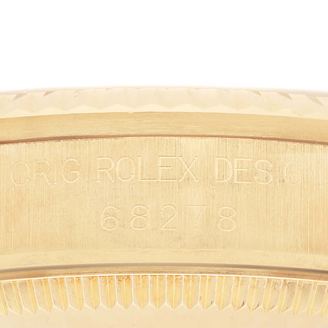 The image shows a close-up of the engraved reference number and part of the fluted bezel on a Rolex President 68278MR Women
s Yellow Gold Champagne Dial 68278MR Women
s Yellow Gold Champagne Dial model watch.