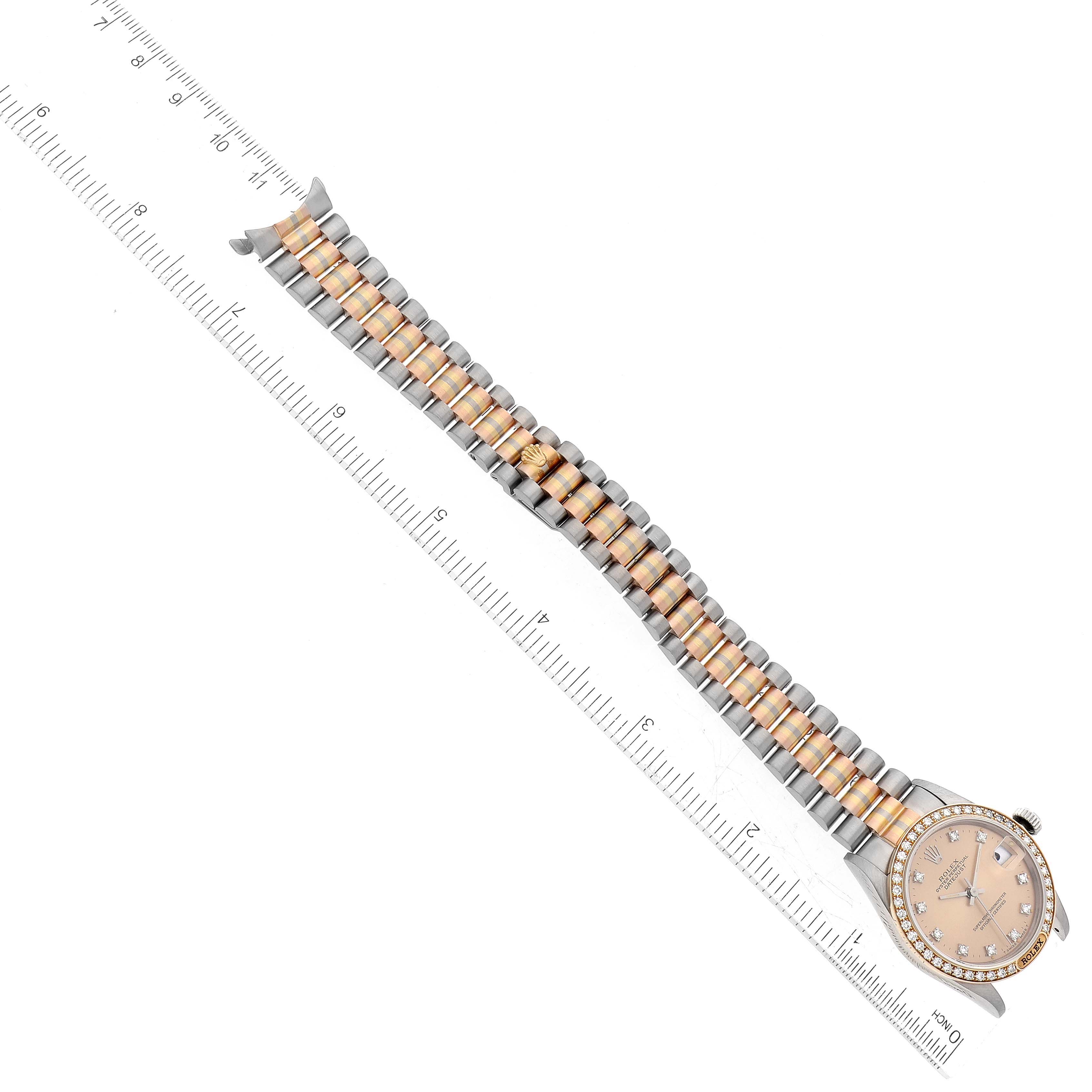 The image shows the Rolex President 68149 Women's White Gold Champagne Dial 68149 Women's White Gold Champagne Dial model watch with its bracelet fully extended and aligned with a ruler.