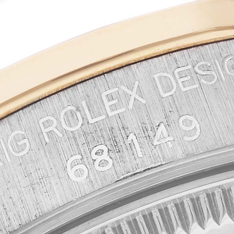 This close-up shows the serial number engraving on the side of the Rolex President 68149 Women's White Gold Champagne Dial 68149 Women's White Gold Champagne Dial model watch case.