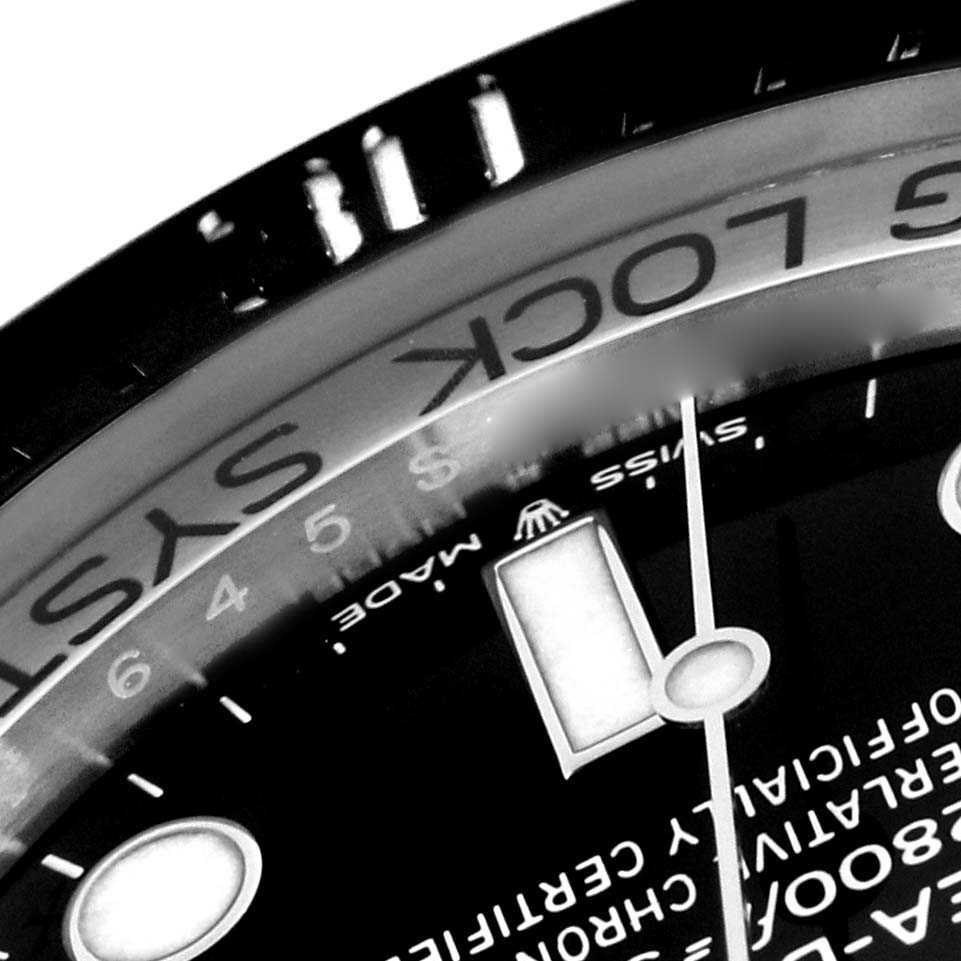 This image shows a close-up of the bezel, part of the dial, and hands of the Rolex Sea-Dweller 126660 Men
s Stainless Steel Black Dial 126660 Men
s Stainless Steel Black Dial watch.