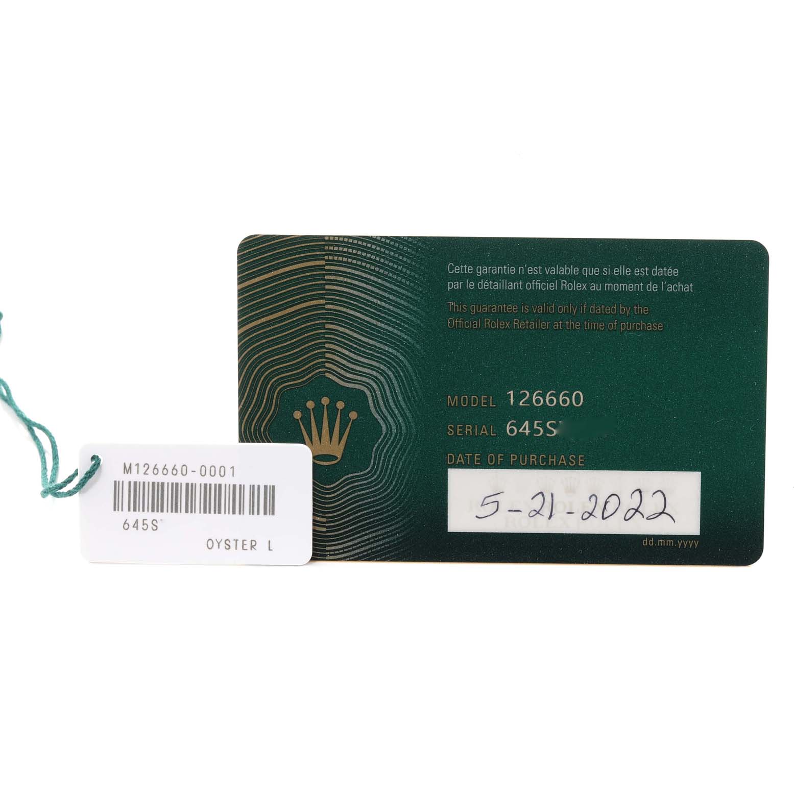 The image shows a Rolex warranty card and tag for the Sea-Dweller model, with model number 126660 and a purchase date.