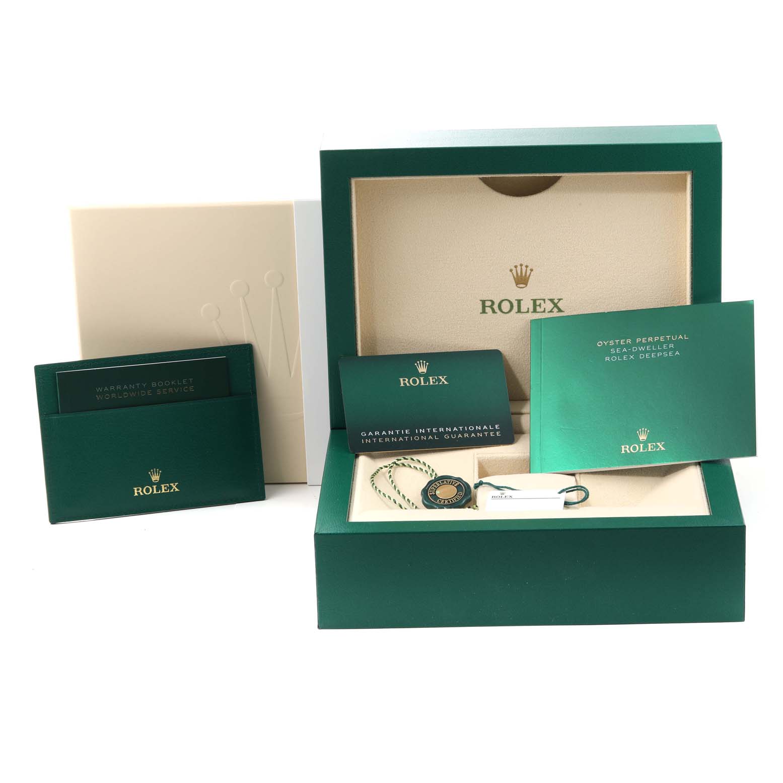 The image shows the packaging and accessories for a Rolex Sea-Dweller 126660 Men
s Stainless Steel Black Dial 126660 Men
s Stainless Steel Black Dial watch, including the box, booklets, warranty card, and tag.