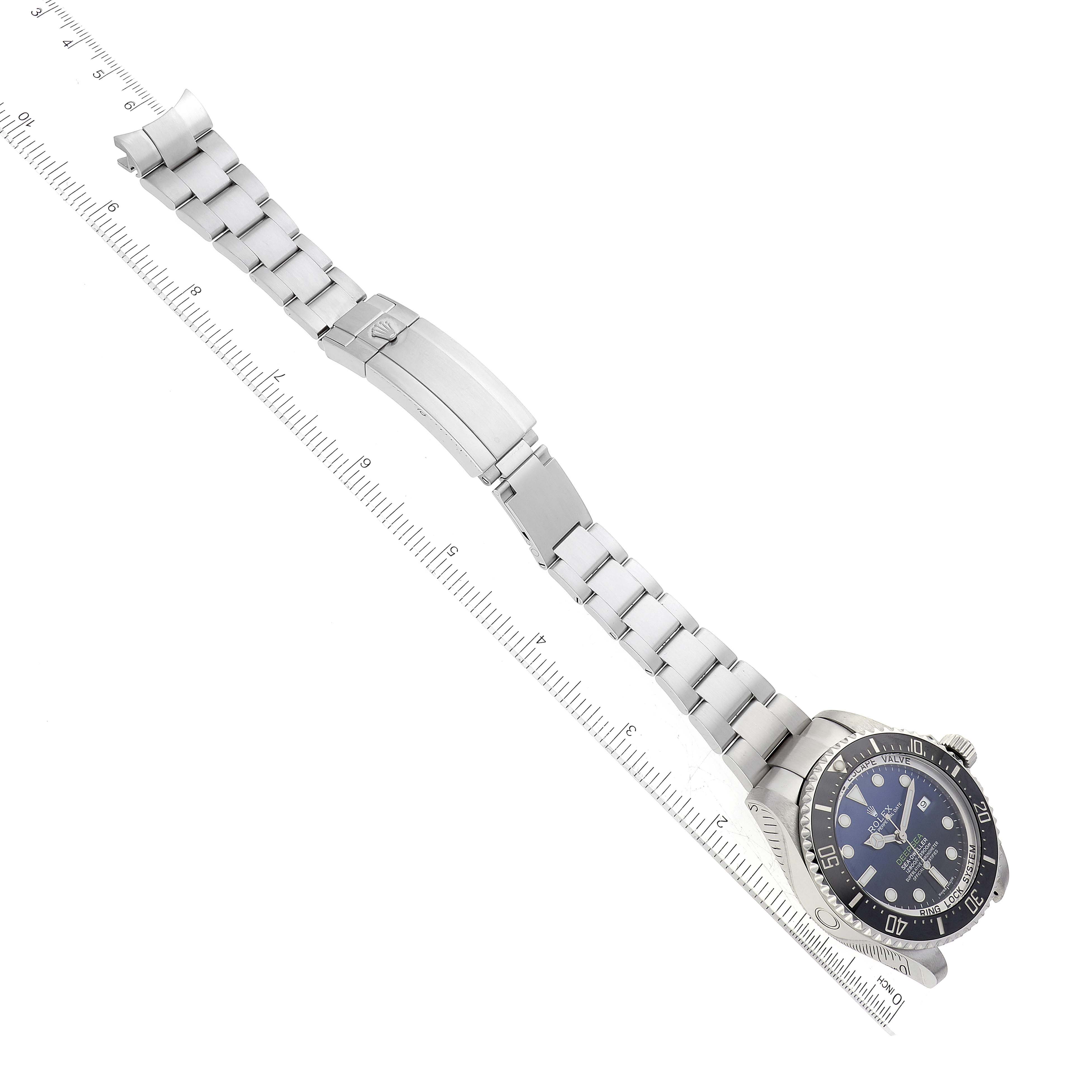 The Rolex Sea-Dweller 116660 Men's Stainless Steel Blue Dial 116660 Men's Stainless Steel Blue Dial watch is shown at an angle displaying the face, bezel, and partially extended metal bracelet with clasp.