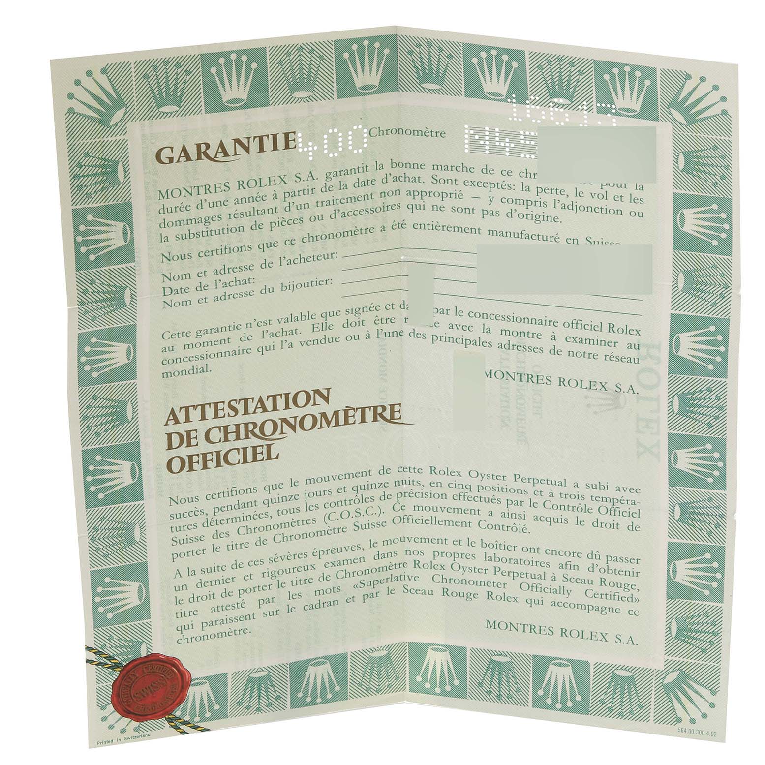 The image shows a folded warranty and chronometer certificate for the Rolex Submariner 16613 Men
s Steel and Gold (two tone) Blue Dial 16613 Men
s Steel and Gold (two tone) Blue Dial watch.