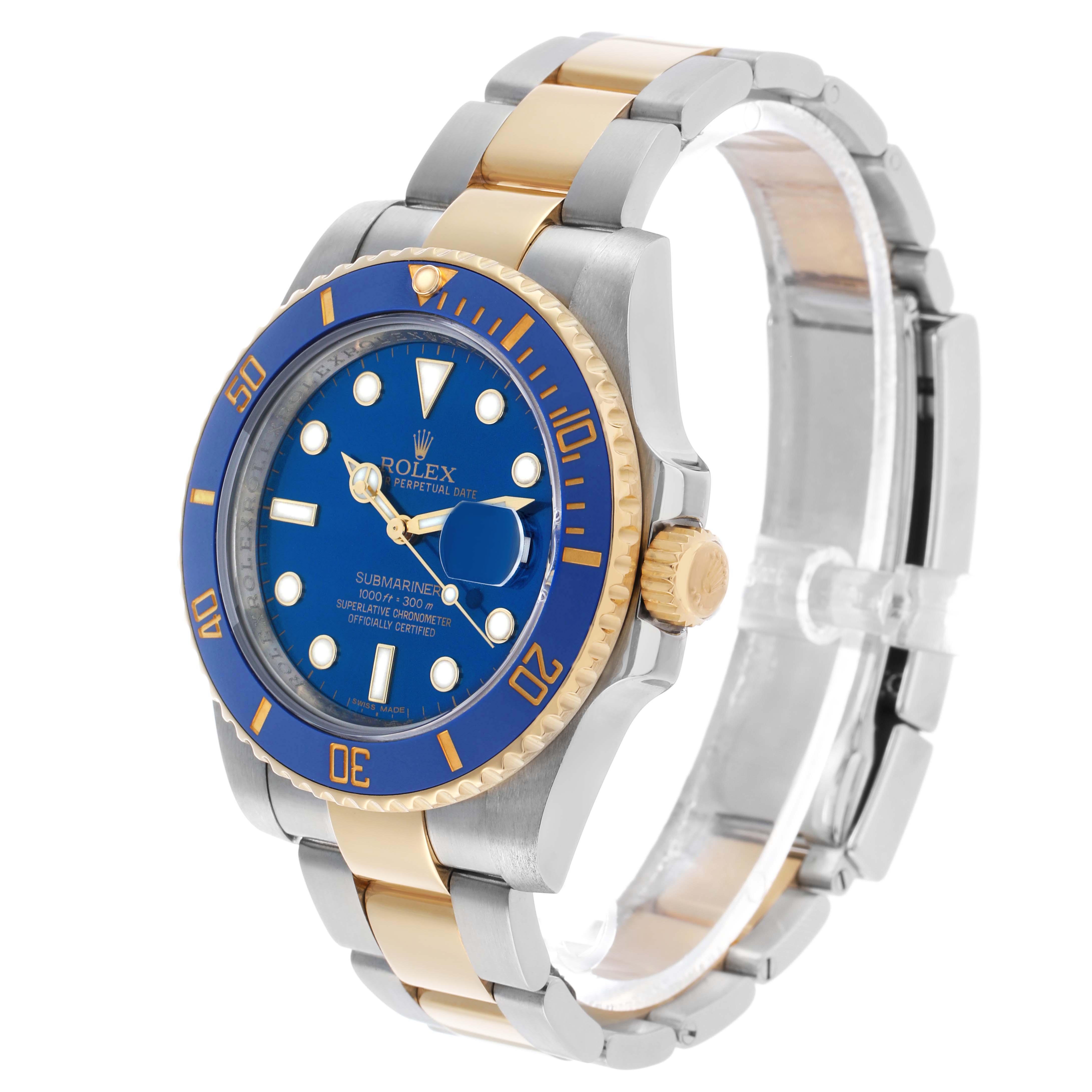 The Rolex Submariner 116613F Men's Steel and Gold (two tone) Blue Dial watch is shown from a three-quarter angle, highlighting its blue dial, bezel, and two-tone bracelet.