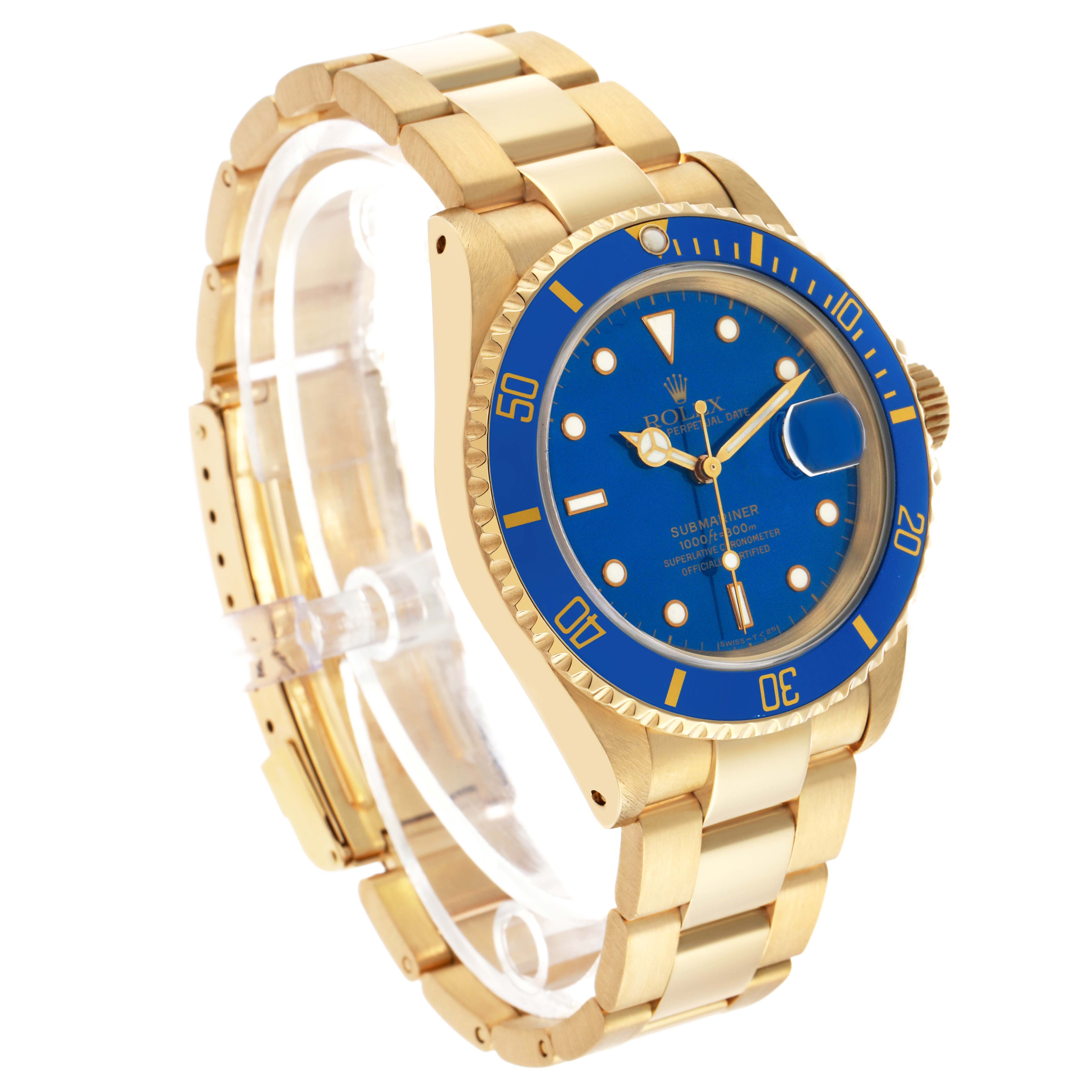 The Rolex Submariner 16618 Men's Yellow Gold Blue Dial watch is shown at a three-quarter angle, highlighting the gold bracelet, blue bezel, and dial.