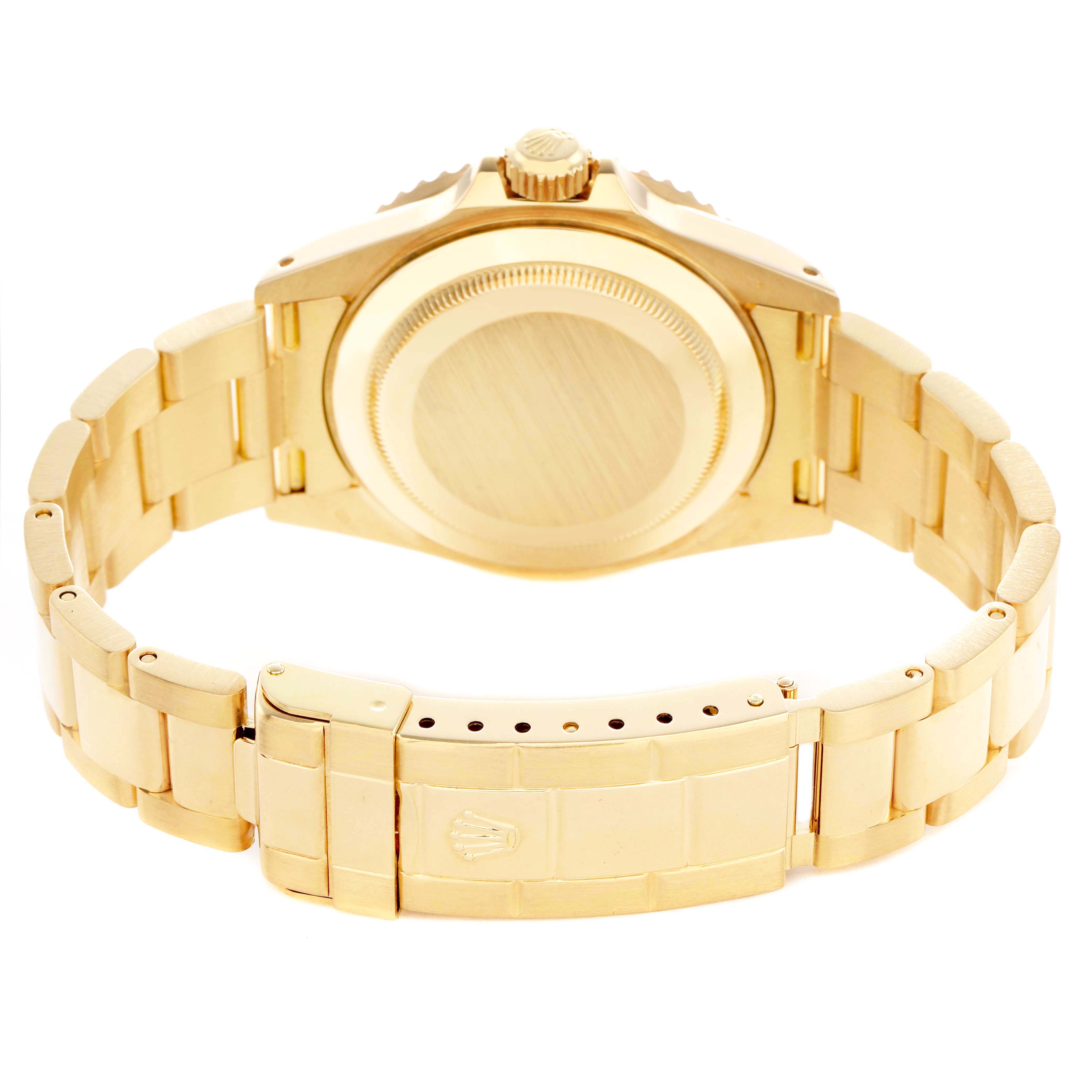 The image shows a Rolex Submariner 16618 Men's Yellow Gold Blue Dial from the back, highlighting the case back, crown, and metal bracelet with clasp.