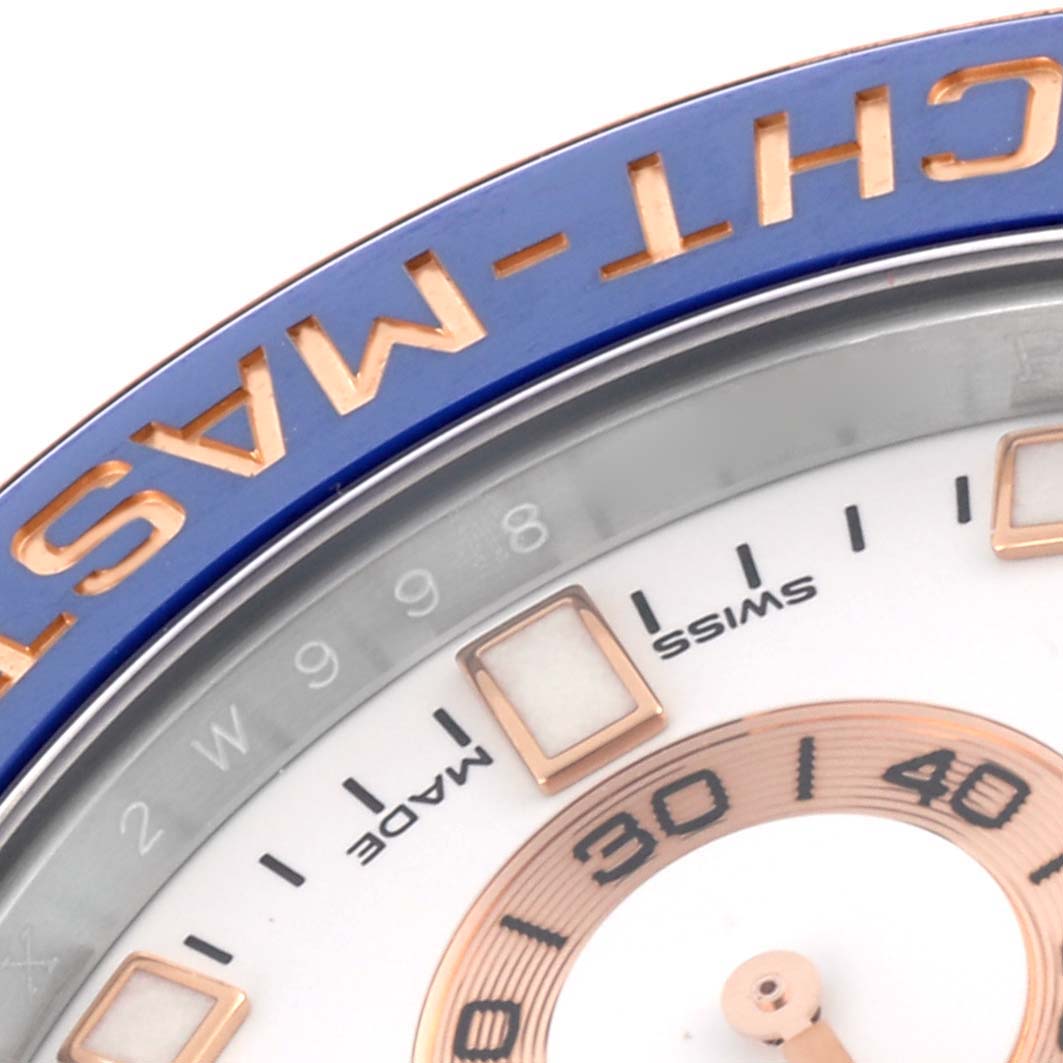The image shows a close-up of the bezel and part of the dial of a Rolex Yacht-Master 116681 Men
s Steel and Gold (two tone) White Dial 116681 Men
s Steel and Gold (two tone) White Dial, highlighting the "YACHT-MASTER" lettering.