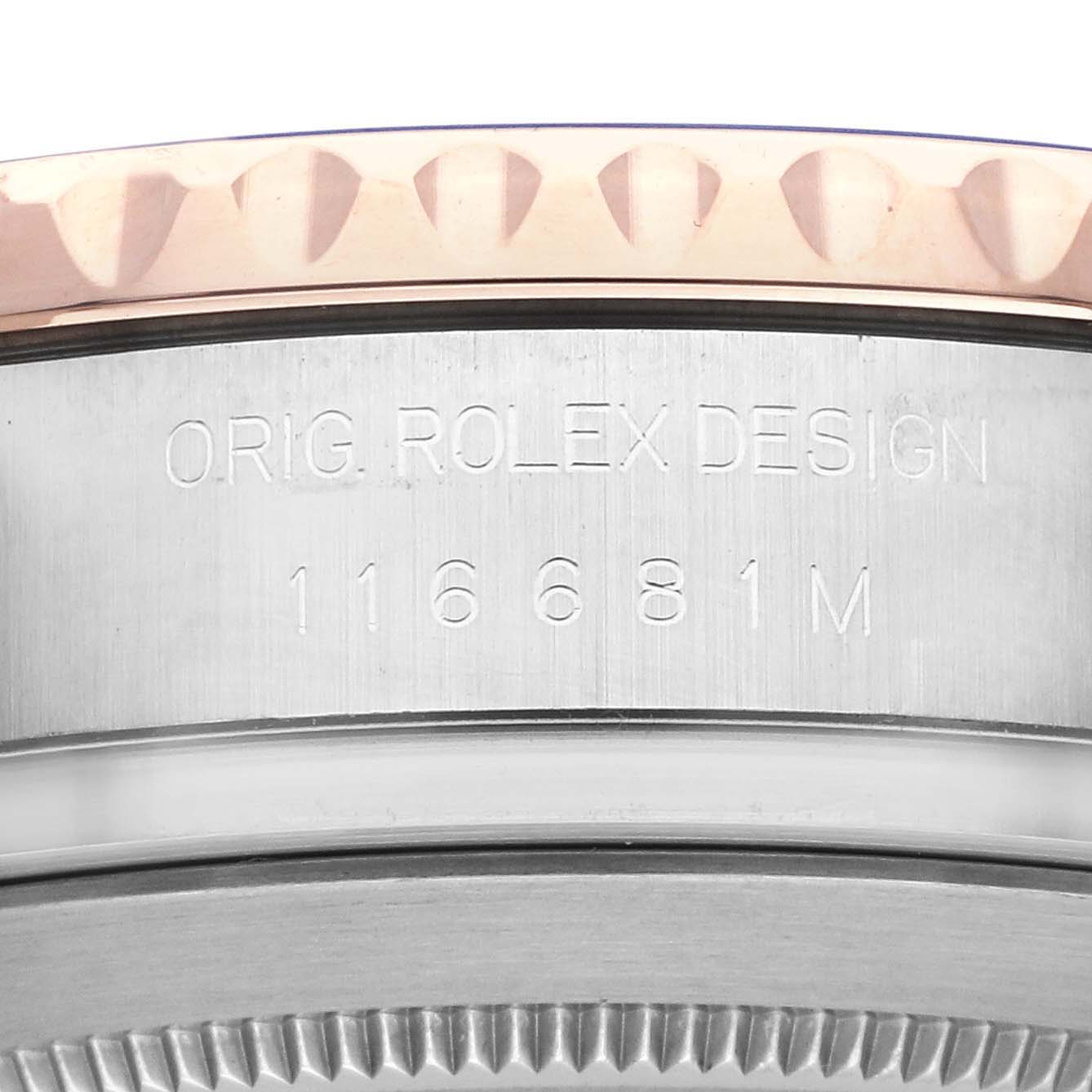 The image shows a close-up of the Rolex Yacht-Master 116681 Men
s Steel and Gold (two tone) White Dial 116681 Men
s Steel and Gold (two tone) White Dial
s edge with engraved model number and design details.