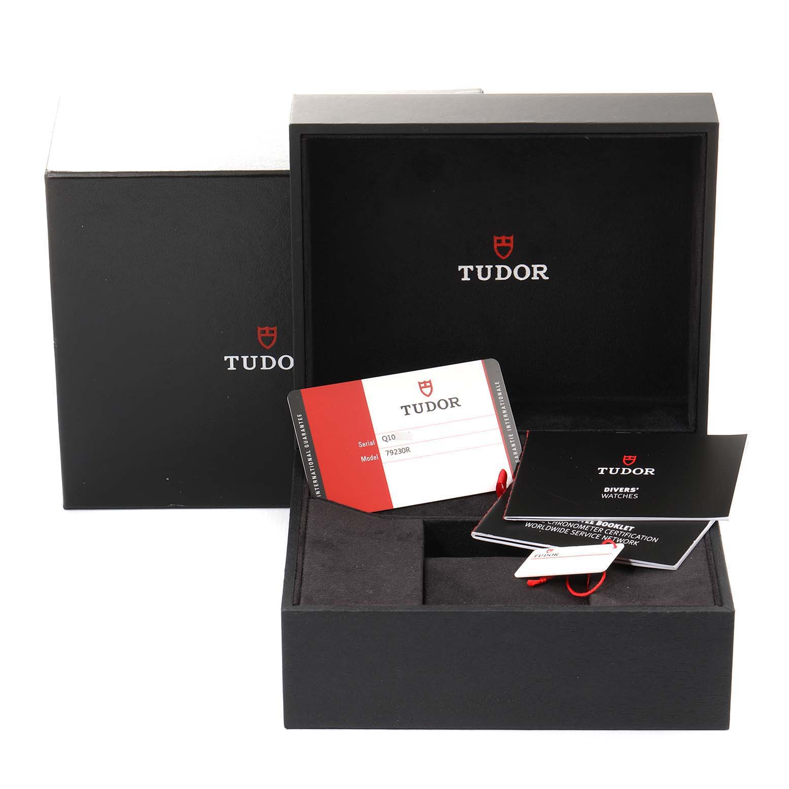 The image shows the Tudor Heritage Black Bay 79230R-0003 Men's Stainless Steel Black Dial box, warranty card, and manuals from a front angle.