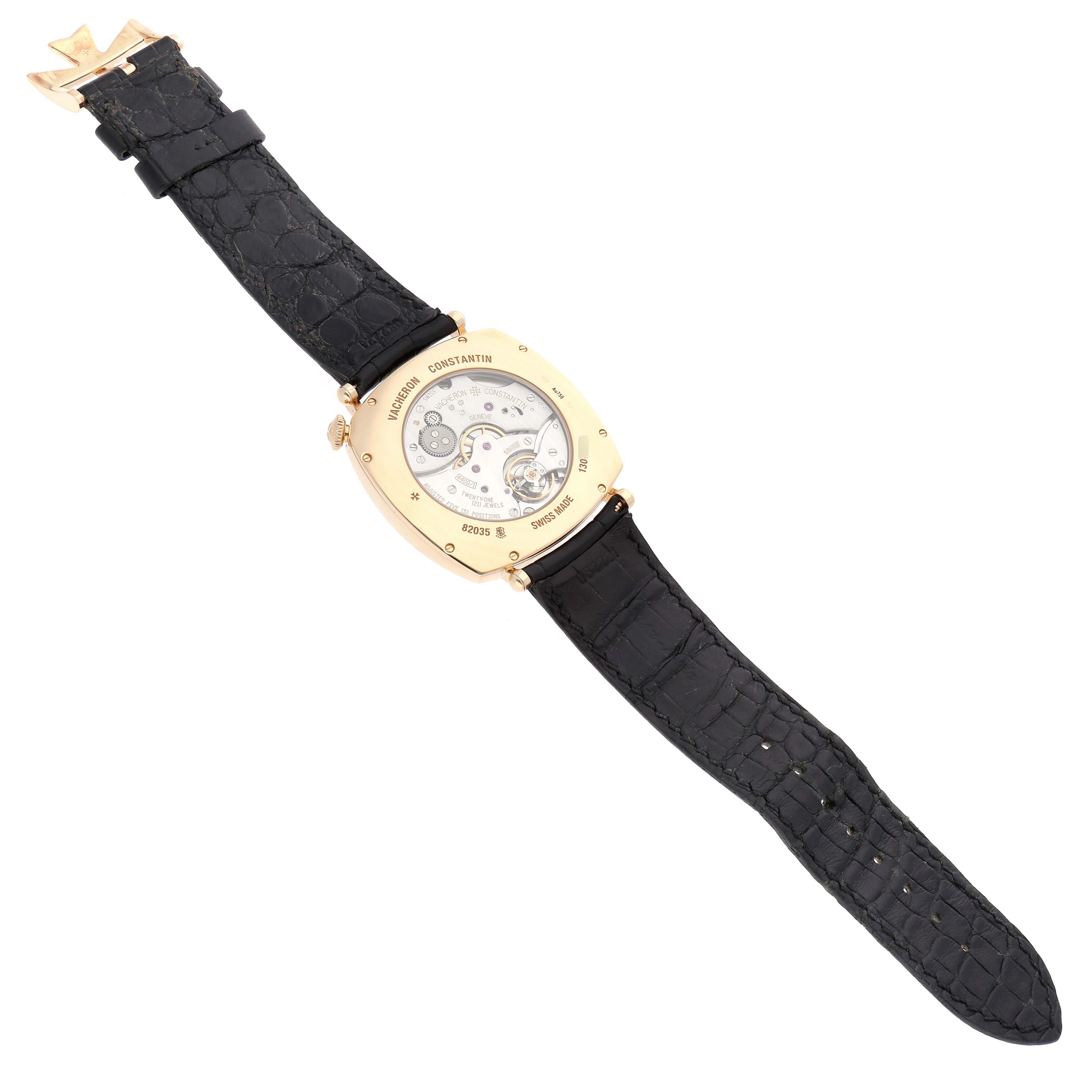 The image shows the back view of a Vacheron Constantin Historiques 82035/000J-9964 Men's Yellow Gold Silver Dial watch, highlighting its movement and strap.