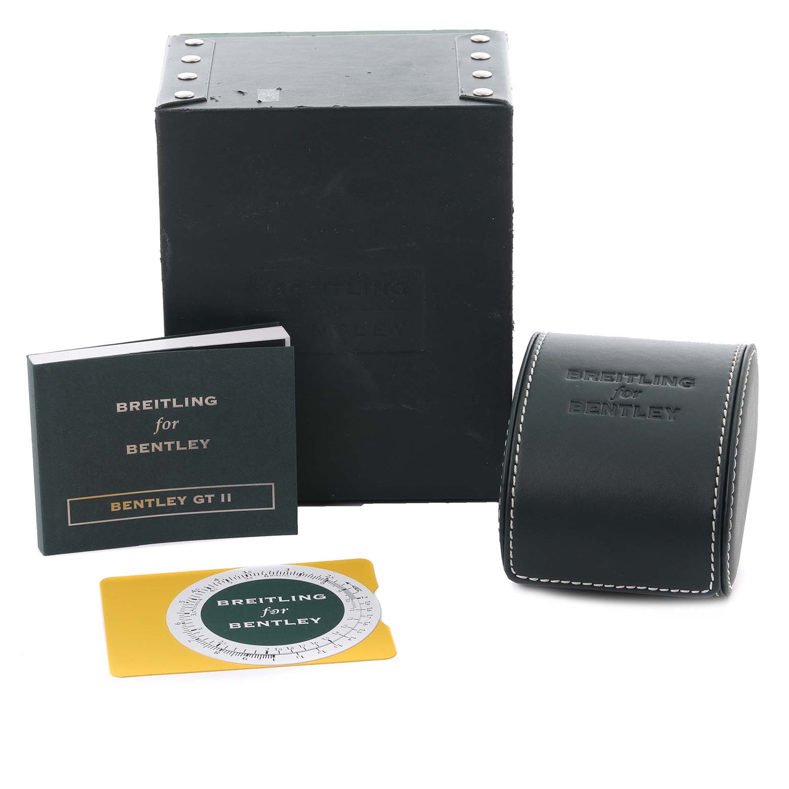 The image shows the Bentley model by Breitling accessories, including a box, manual, case, and a slide rule card from a front angle.
