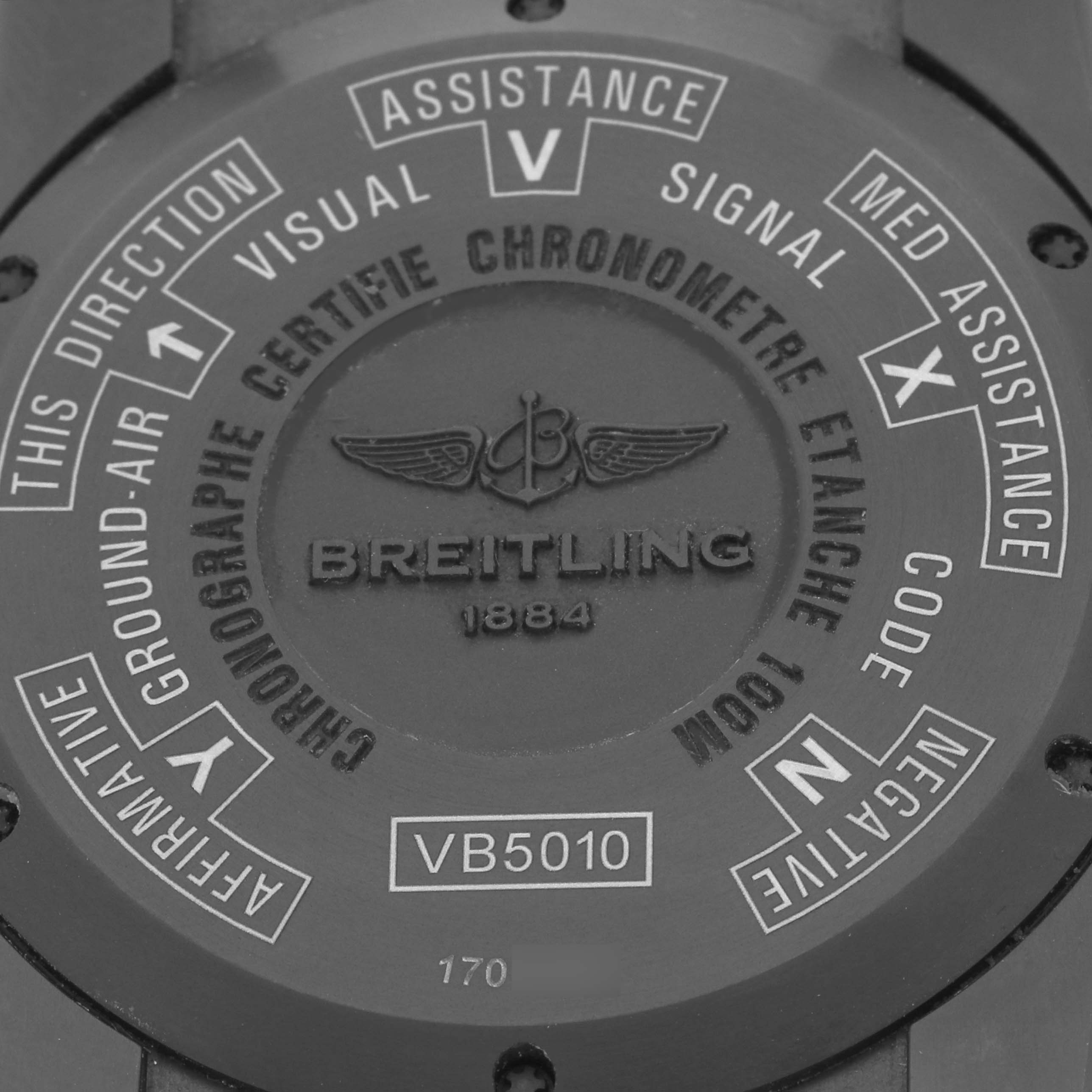 The image shows the back case of the Breitling Professional Series VB501022/BD41 Men's Titanium Black Dial VB501022/BD41 Men's Titanium Black Dial model VB5010, featuring various engraved instructions and the logo.