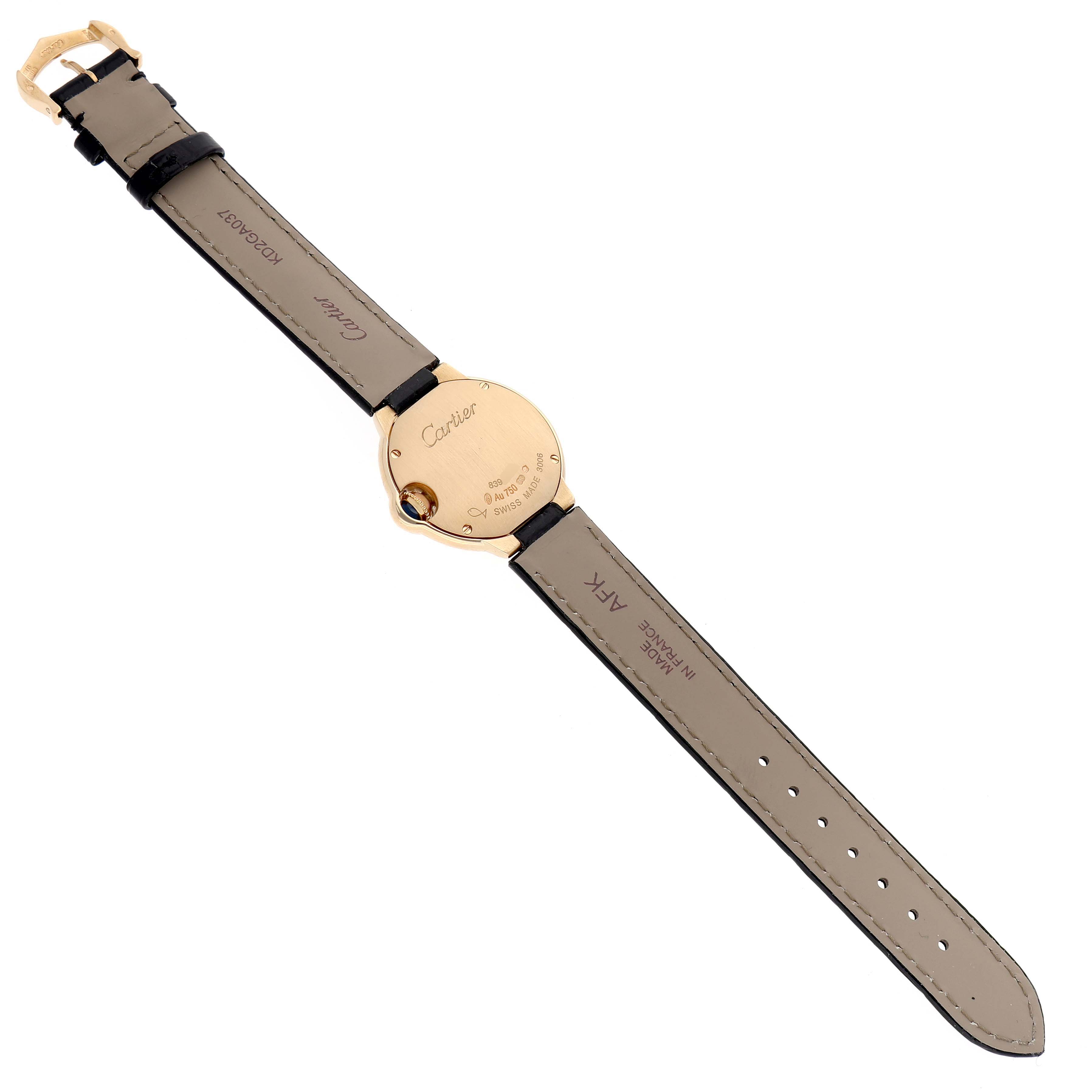 The image shows the back of a Cartier Ballon Bleu W6900156 Women's Yellow Gold Silver Dial watch, highlighting the case back and leather straps.