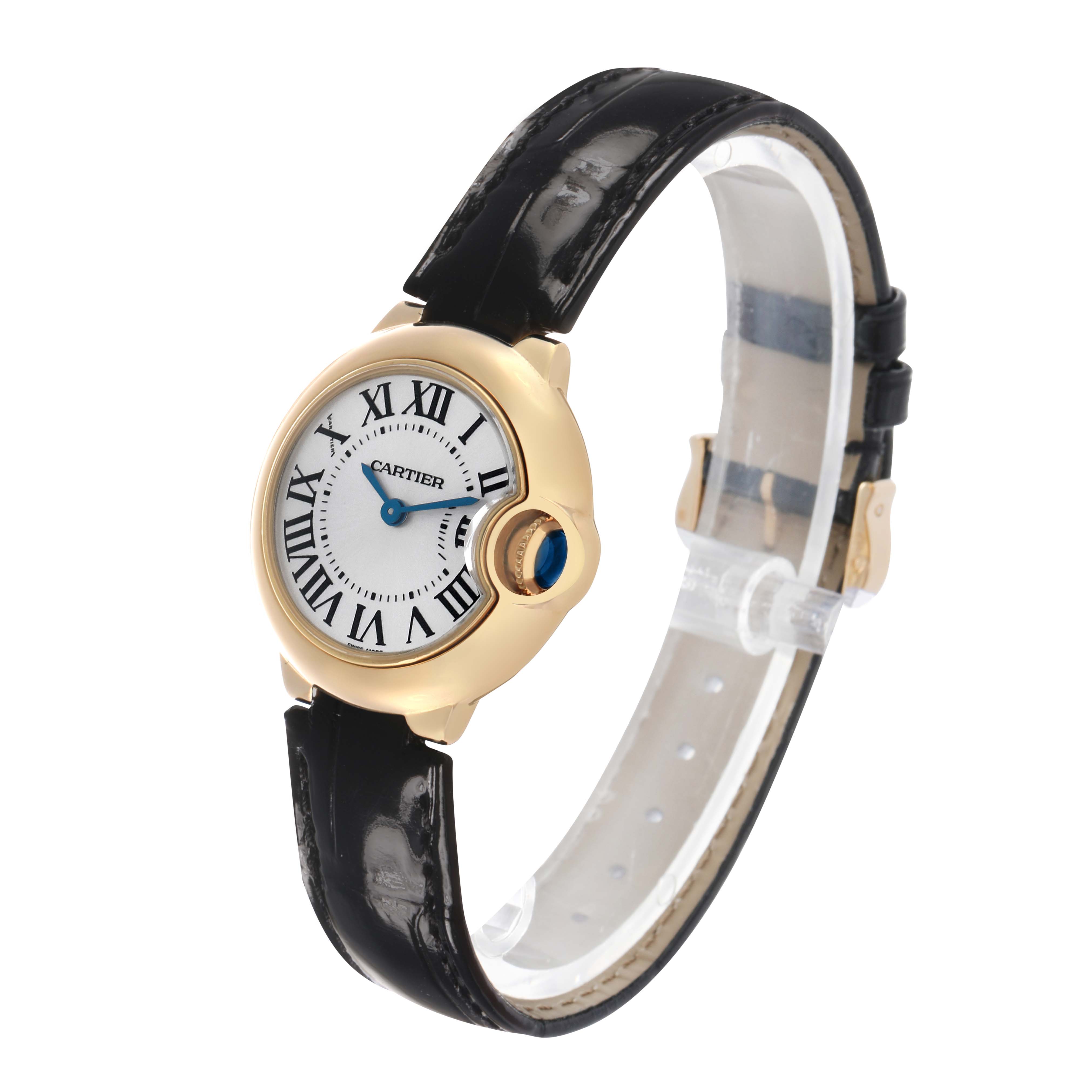 The Cartier Ballon Bleu W6900156 Women's Yellow Gold Silver Dial watch is shown at a three-quarter angle, highlighting the case, crown, and leather strap.