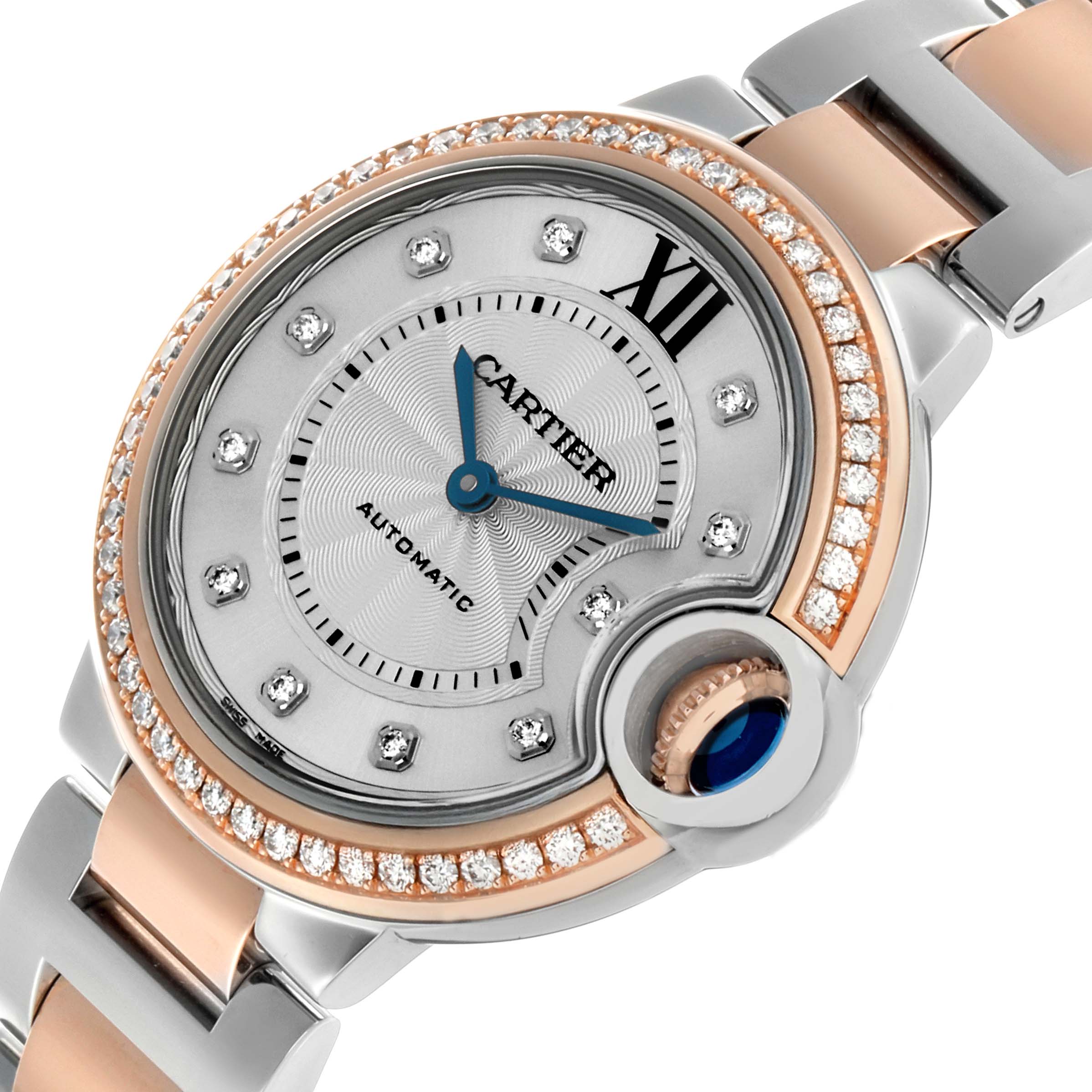 The Cartier Ballon Bleu WE902077 Women's Steel and Gold (two tone) Silver Dial watch is shown at an angled close-up, highlighting the dial, crown, and bracelet details.