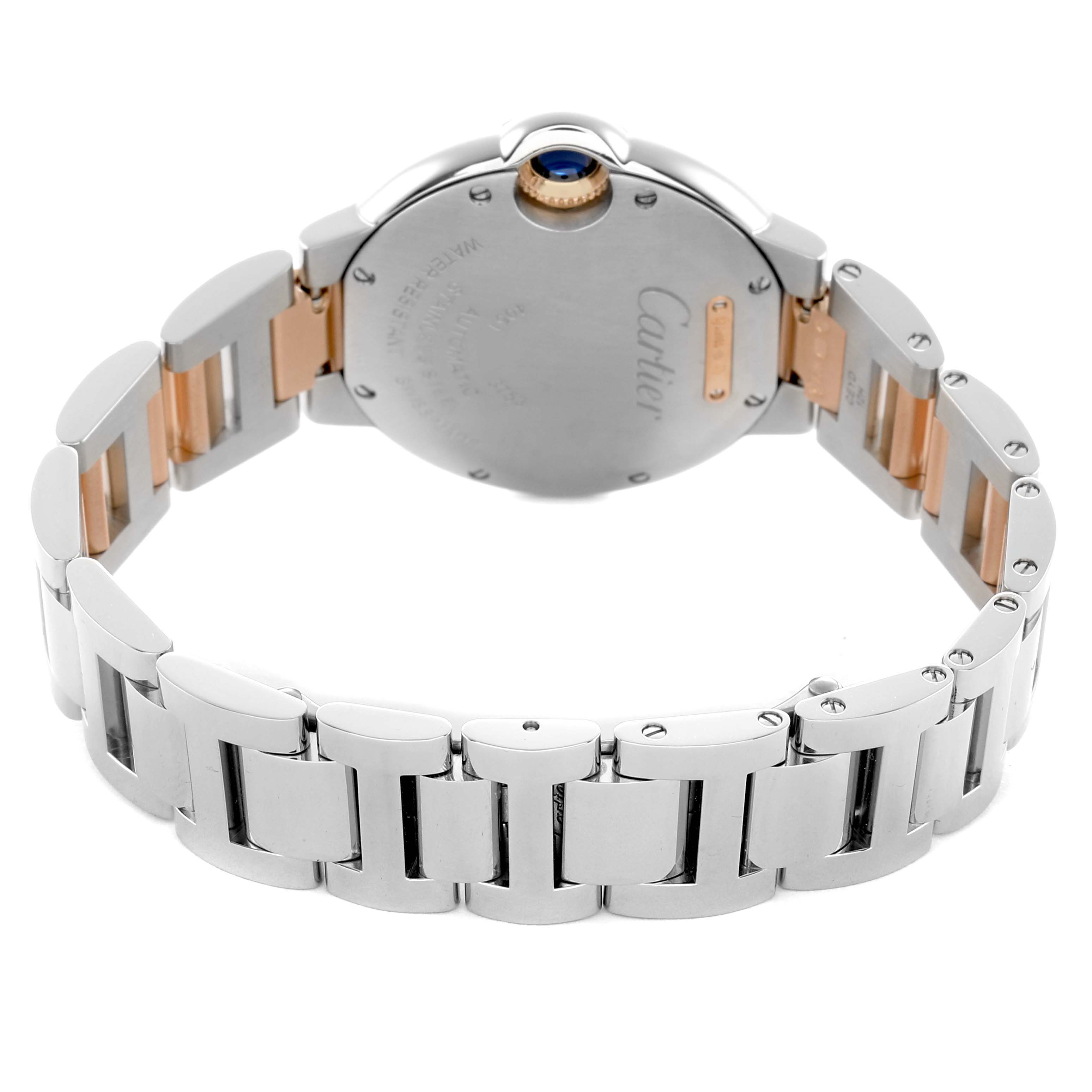 The Cartier Ballon Bleu WE902077 Women's Steel and Gold (two tone) Silver Dial watch is shown from the back, highlighting the bracelet and case back, including the crown with a blue cabochon.