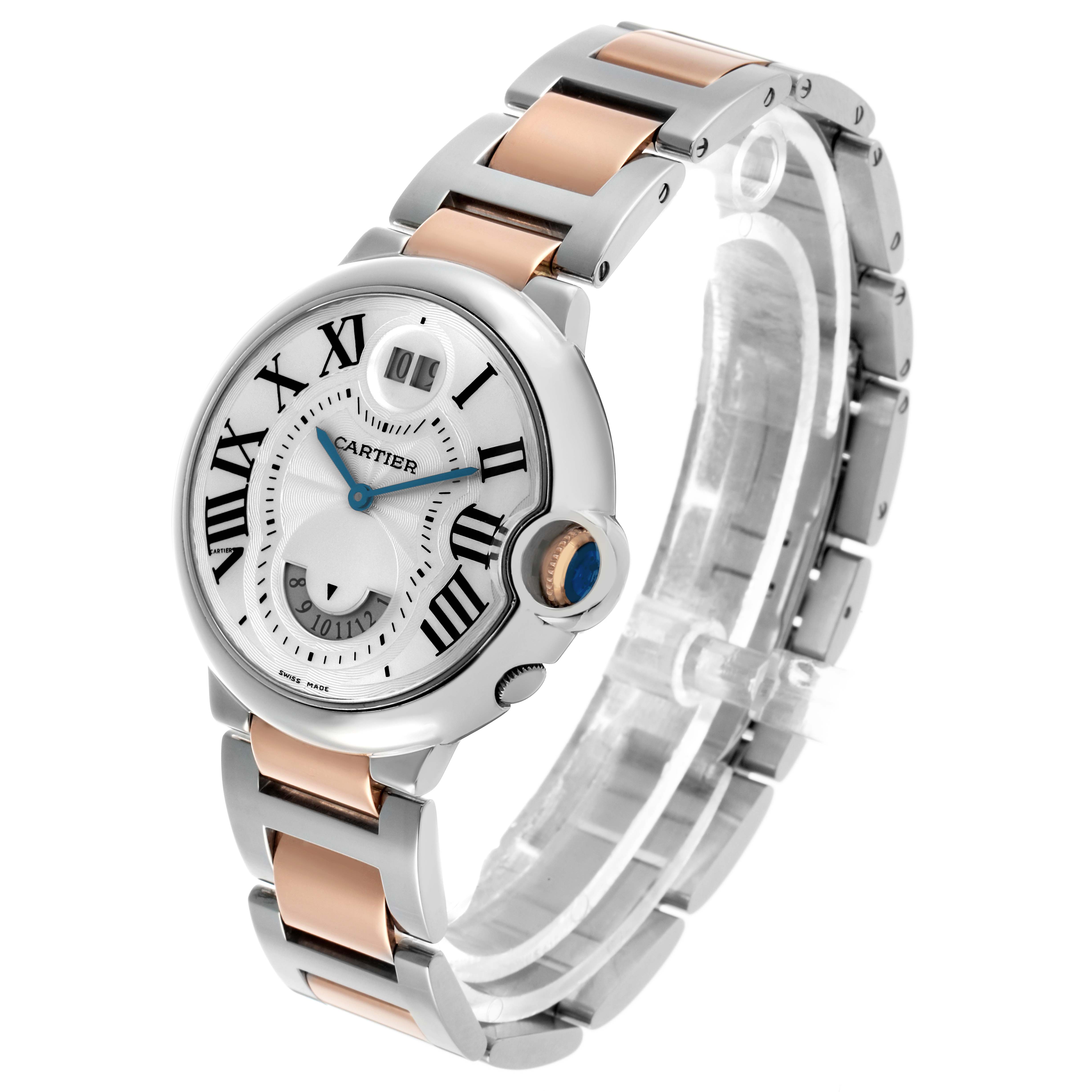 The Cartier Ballon Bleu W6920027 Men's Steel and Gold (two tone) Silver Dial watch is shown in a three-quarter angle, highlighting its face, crown, and two-tone metal bracelet.