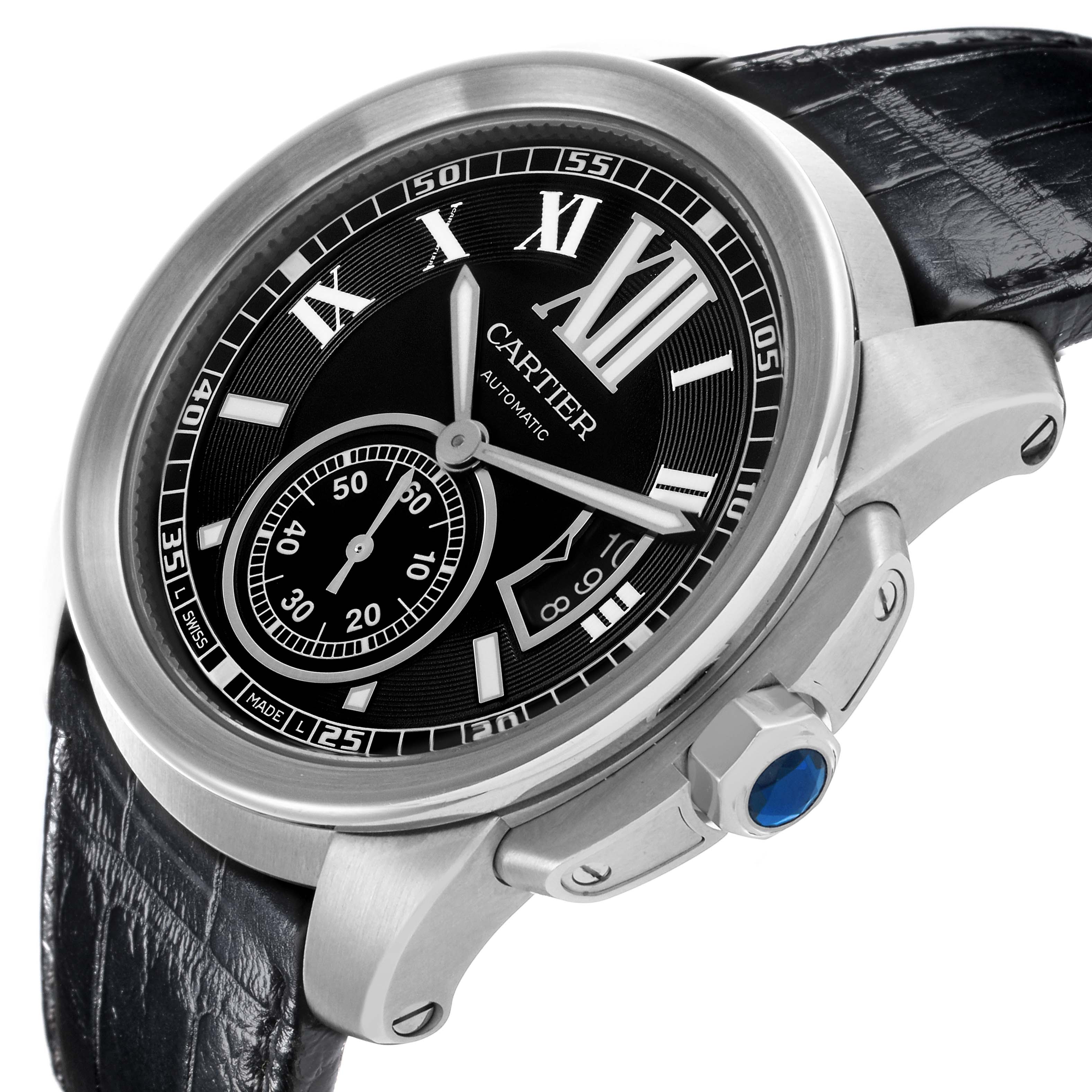 The Calibre de Cartier watch is shown at an angled view highlighting the dial, case, crown, and part of the strap.