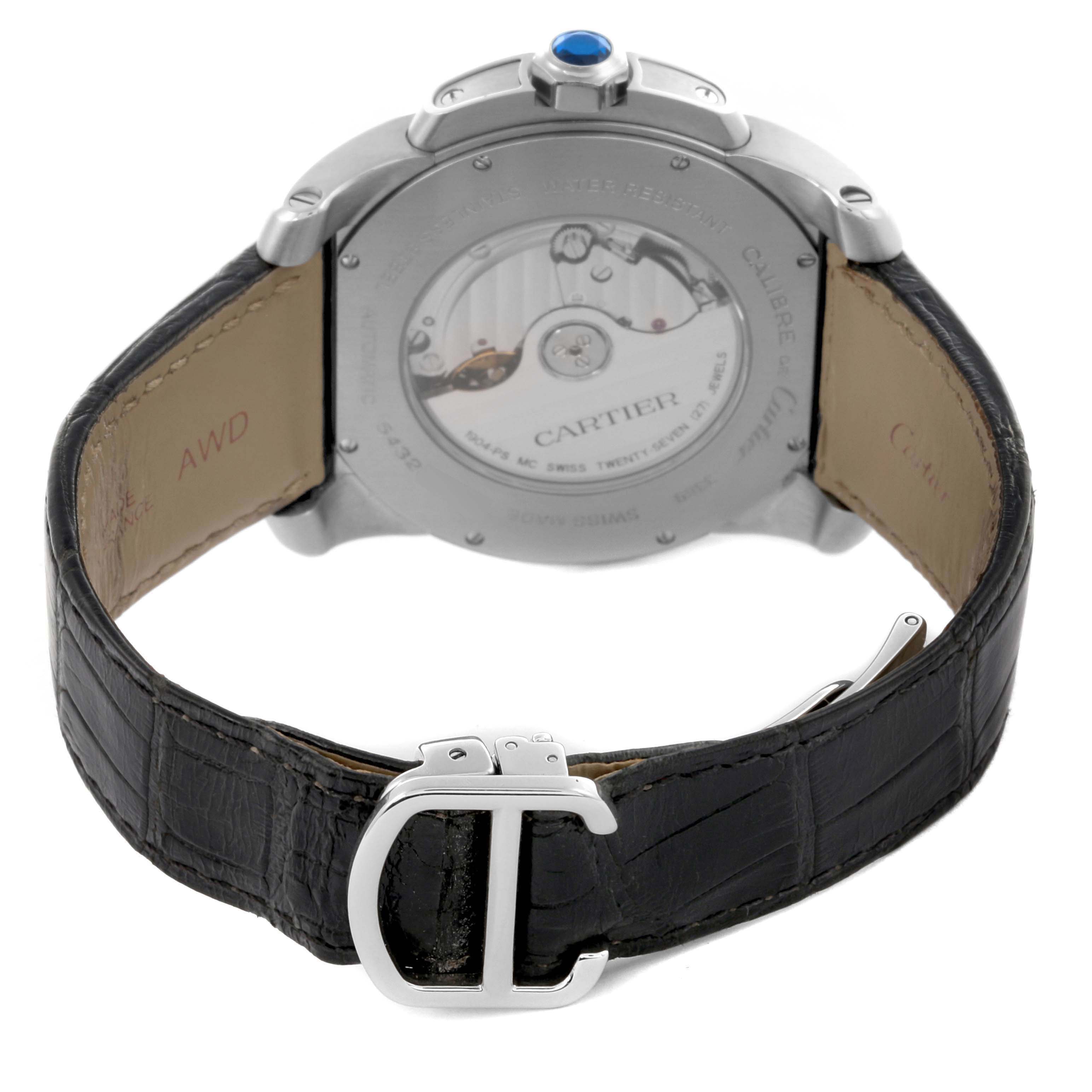 The image shows the back view of the Calibre de Cartier watch, focusing on the case back, strap, and buckle.