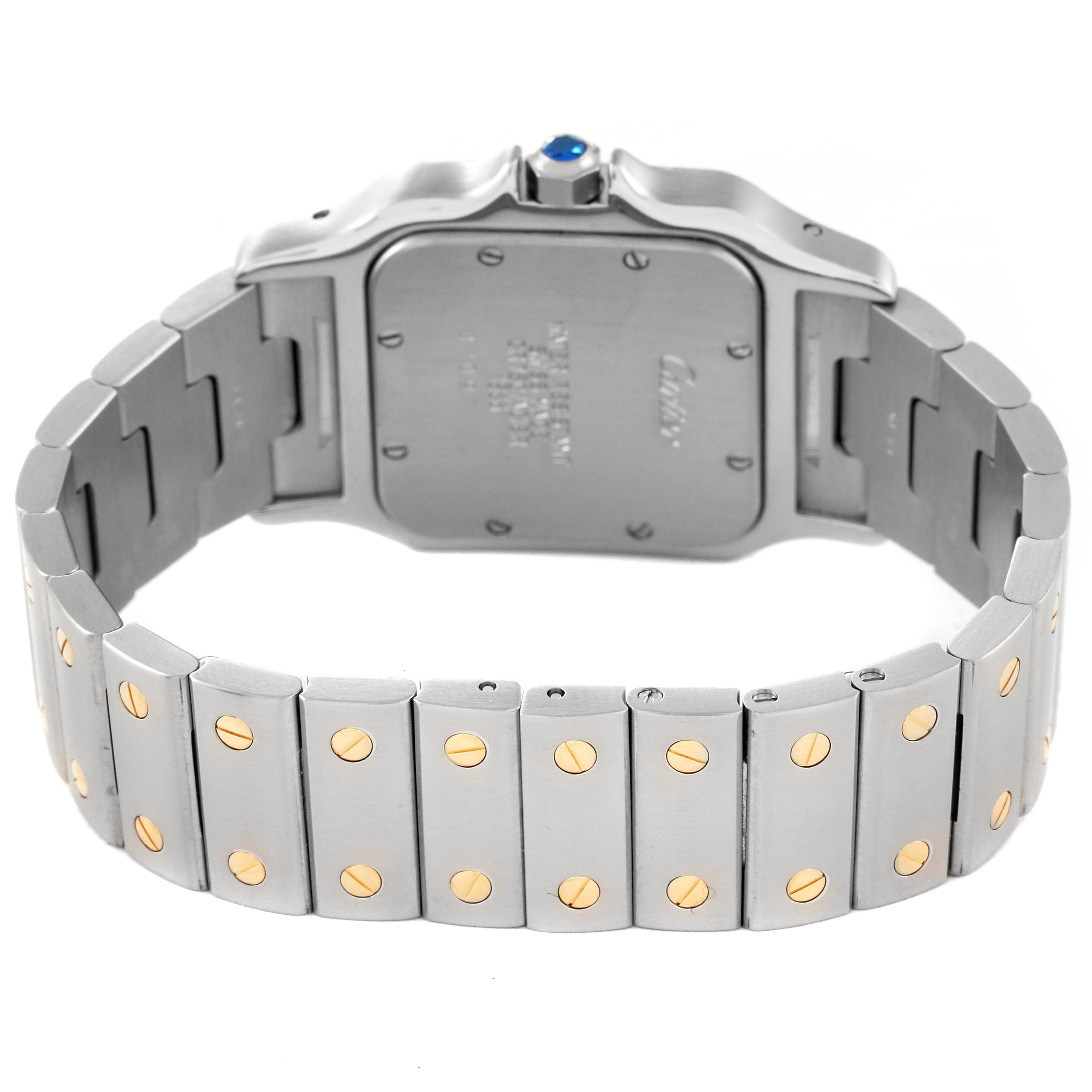 The image shows the back case and bracelet of the Cartier Santos W20011C4 Men
s Steel and Gold (two tone) Silver Dial W20011C4 Men
s Steel and Gold (two tone) Silver Dial watch, highlighting its screw accents and metal links.