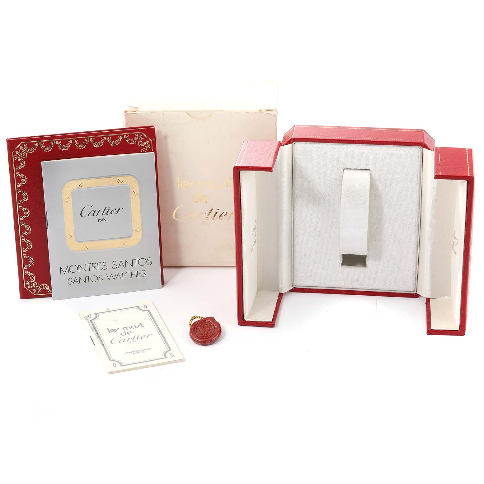 The image shows an open box for a Cartier Santos W20012C4 Women's Steel and Gold (two tone) Silver Dial W20012C4 Women's Steel and Gold (two tone) Silver Dial watch and its accompanying accessories, including manuals and packaging.