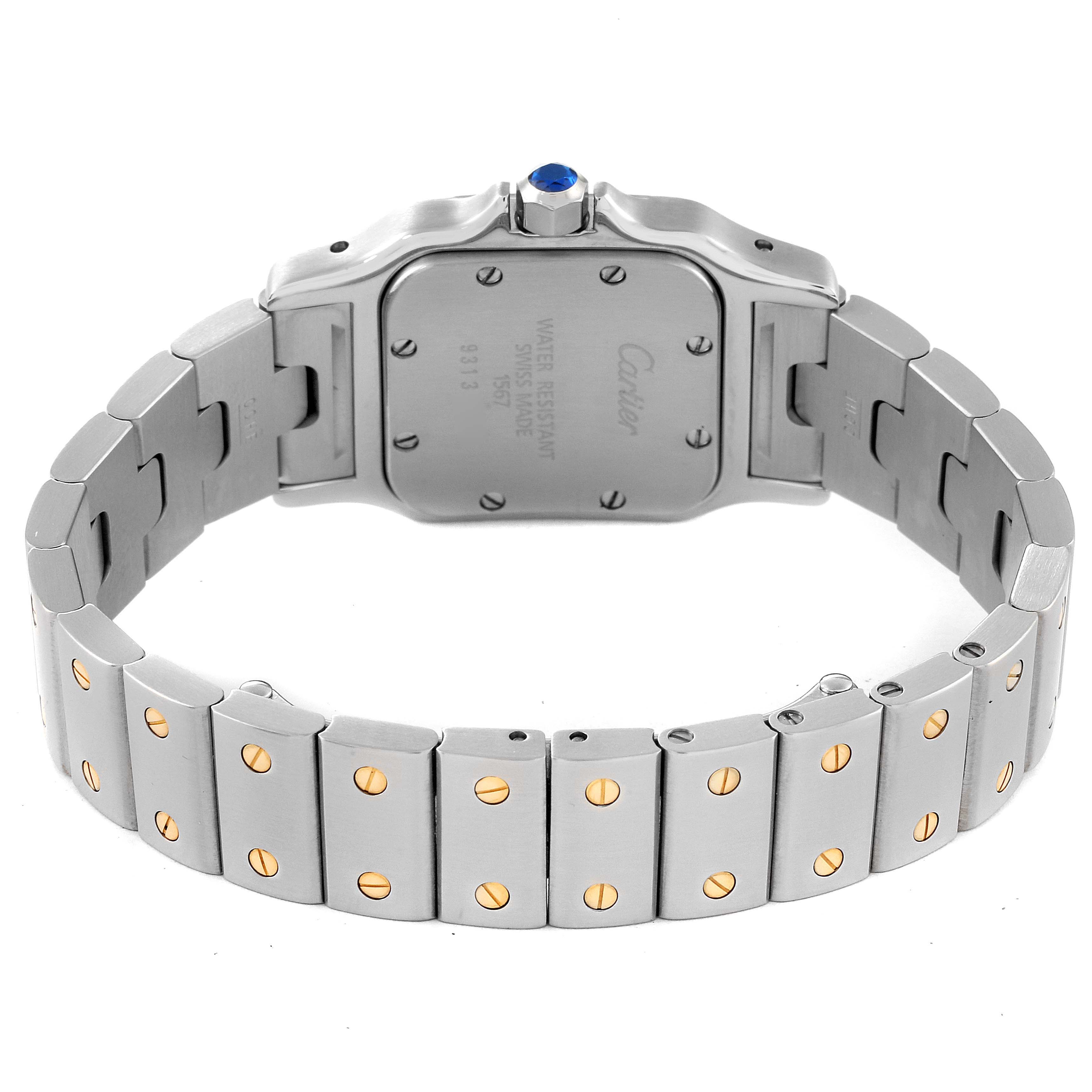 The image shows the backside of a Santos model by Cartier, highlighting its stainless steel case and bracelet.
