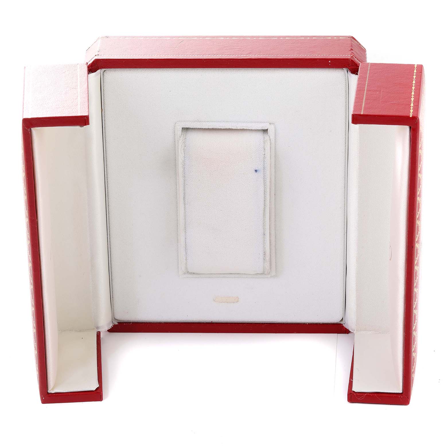 This is an open view of the red and white storage box for a Santos model watch by Cartier.