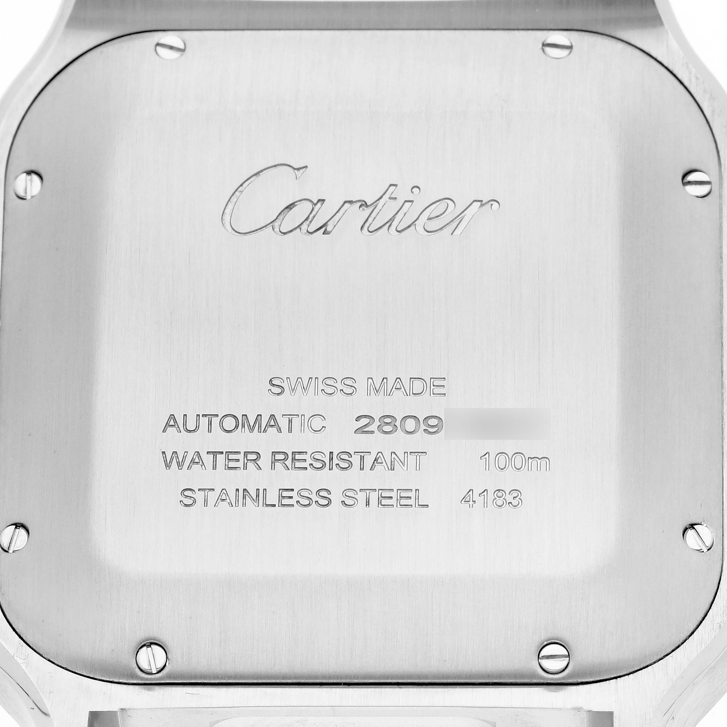 The image shows the back case of a Cartier Santos WSSA0017 Men's Stainless Steel Silver Dial WSSA0017 Men's Stainless Steel Silver Dial watch with inscriptions and screws visible.