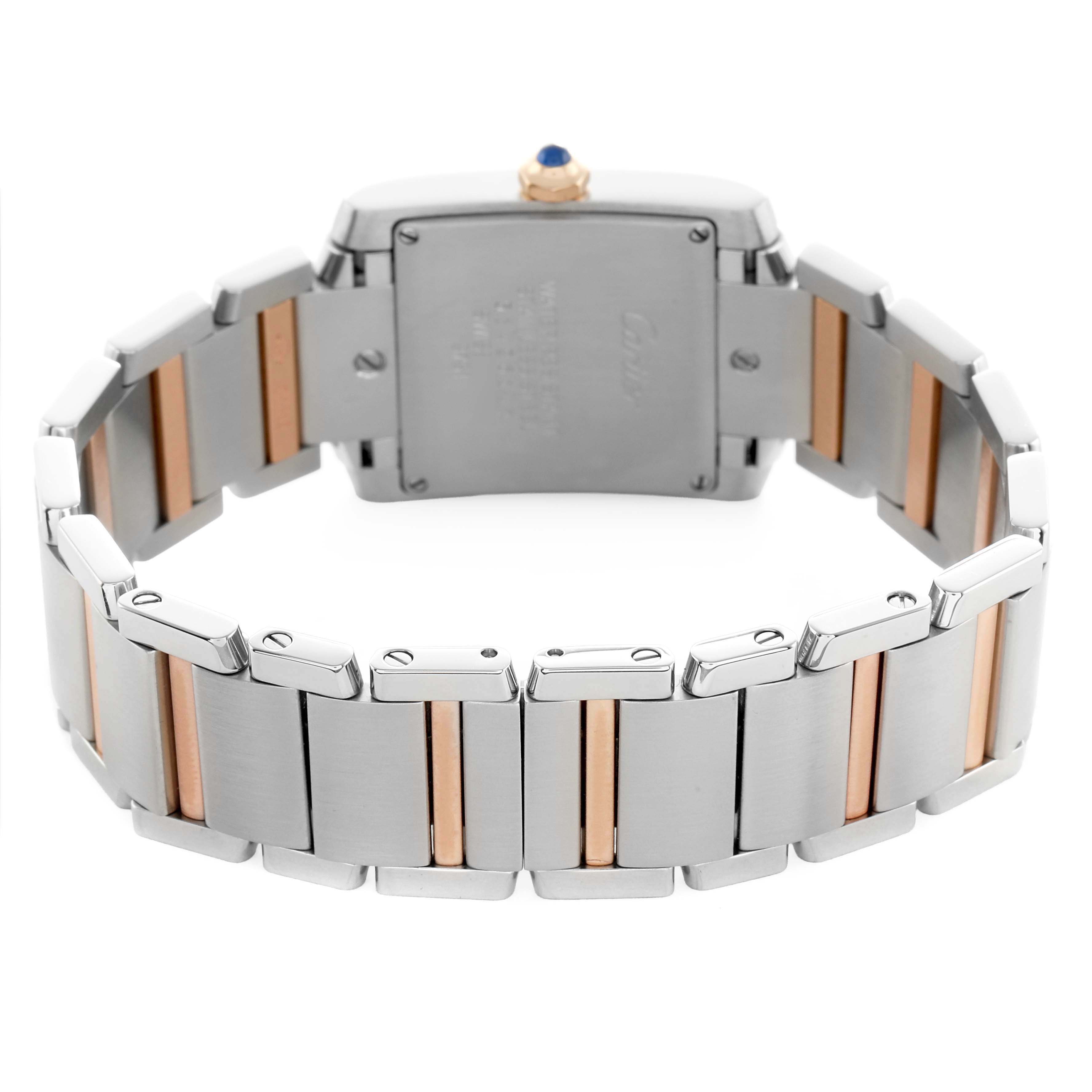 The image shows the back of the Cartier Tank Française watch, focusing on the bracelet and case back.