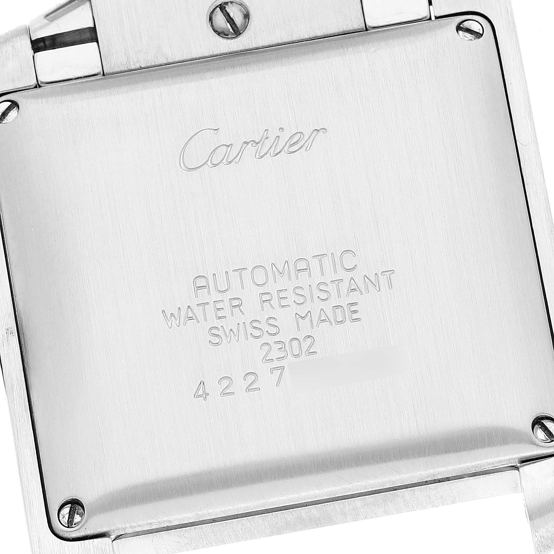 The image shows the backside of a Cartier Tank Francaise W51005Q4 Men's Steel and Gold (two tone) Silver Dial W51005Q4 Men's Steel and Gold (two tone) Silver Dial watch, highlighting the engraved details.