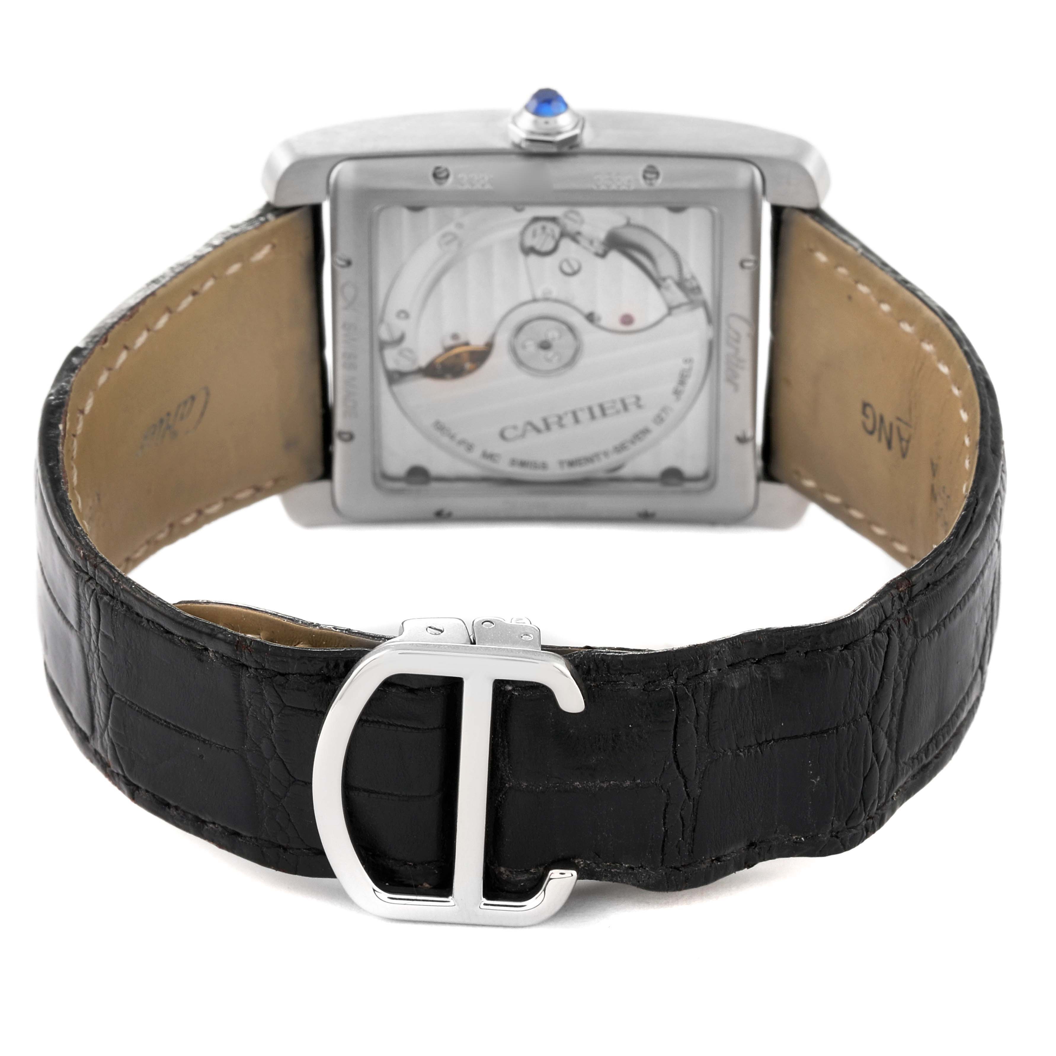 The Cartier Tank MC WSTA0010 Men's Stainless Steel Blue Dial WSTA0010 Men's Stainless Steel Blue Dial watch is shown from the back, highlighting the exposed movement and black leather strap with a "C" logo buckle.