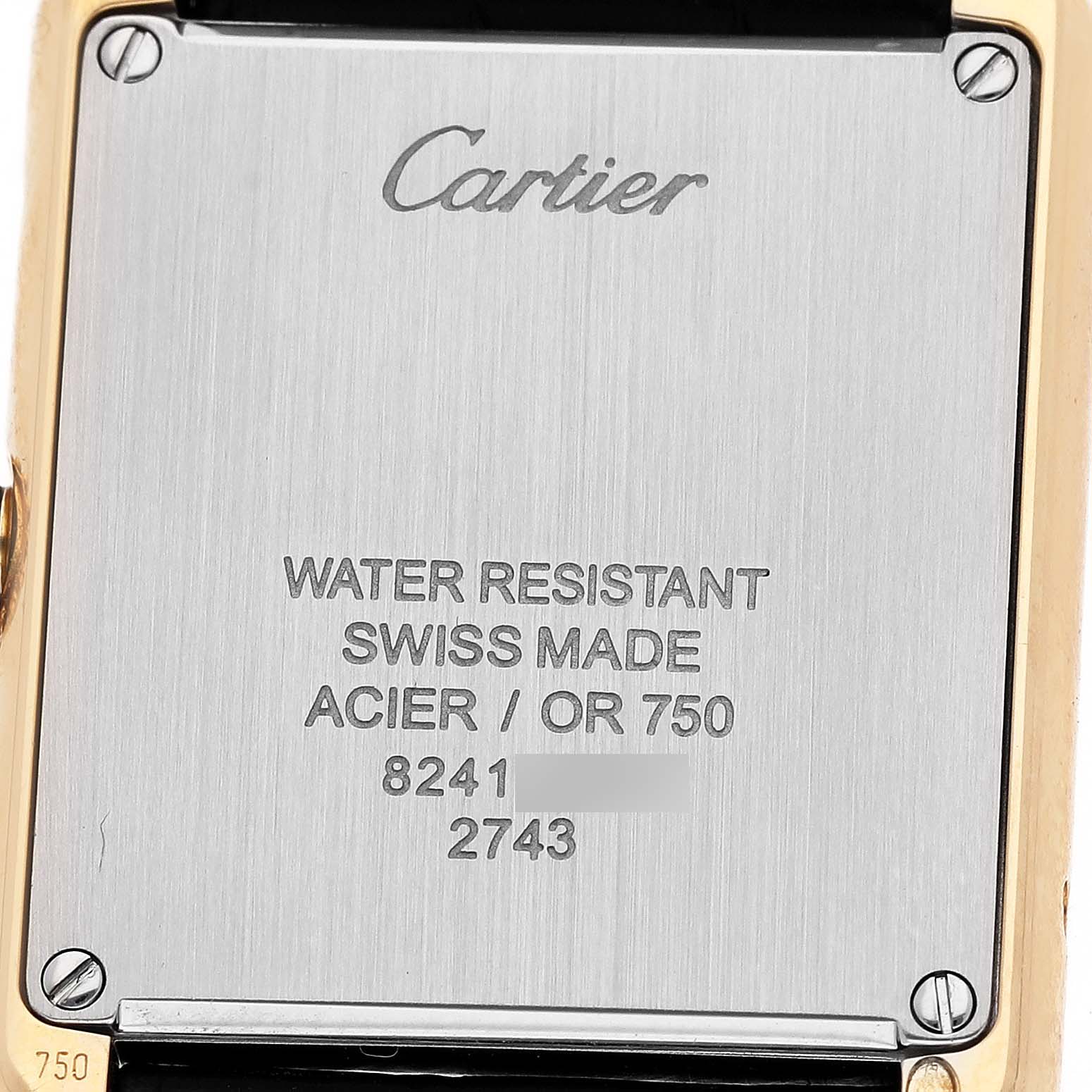 The image shows the back of the Cartier Tank Solo W1018755 Women's Yellow Gold Silver Dial watch, highlighting the branding and specifications.