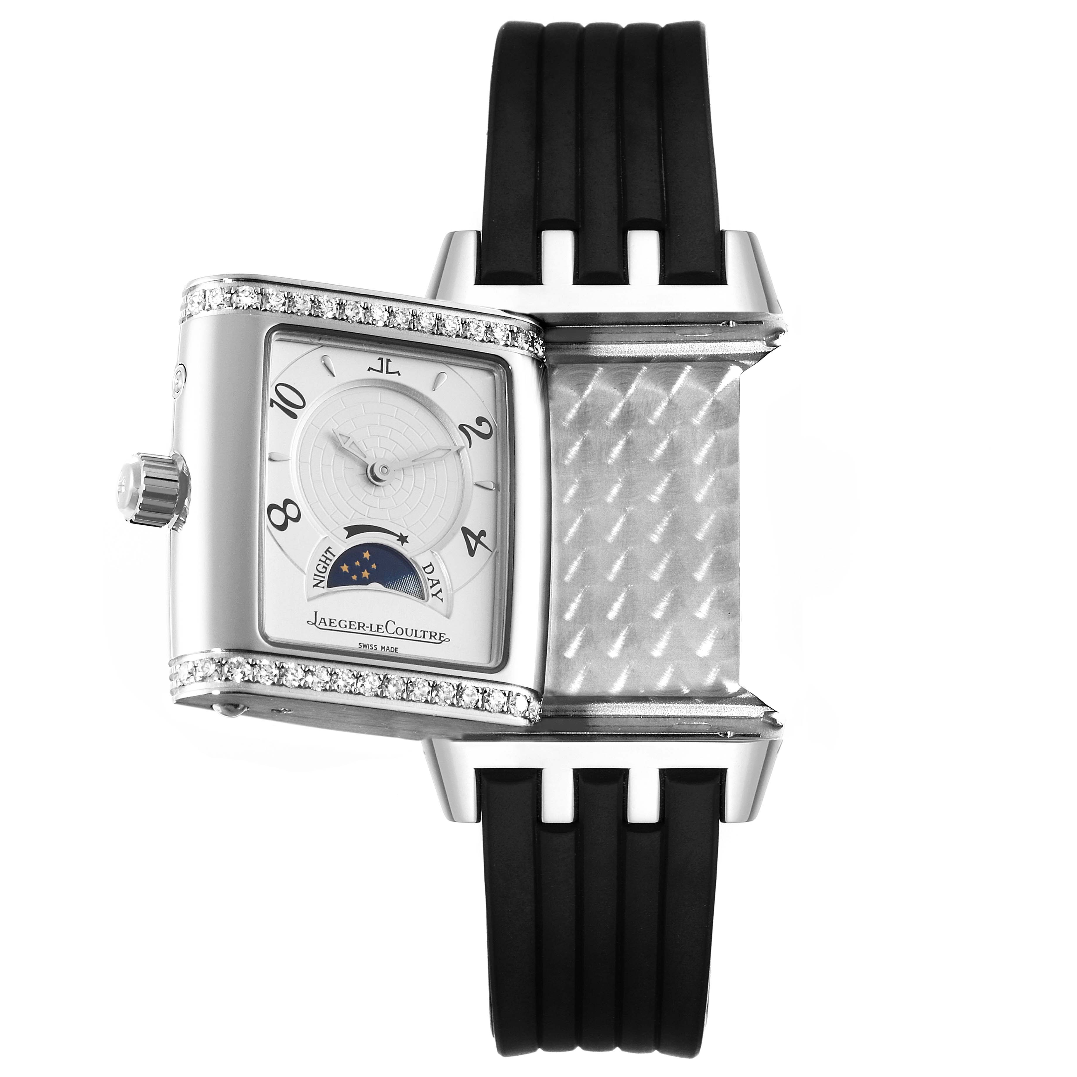 This image shows a Jaeger LeCoultre Reverso 296.8.74 Women's Stainless Steel Silver Dial 296.8.74 Women's Stainless Steel Silver Dial watch with its face rotated, revealing its backside details and partially showing the bracelet.