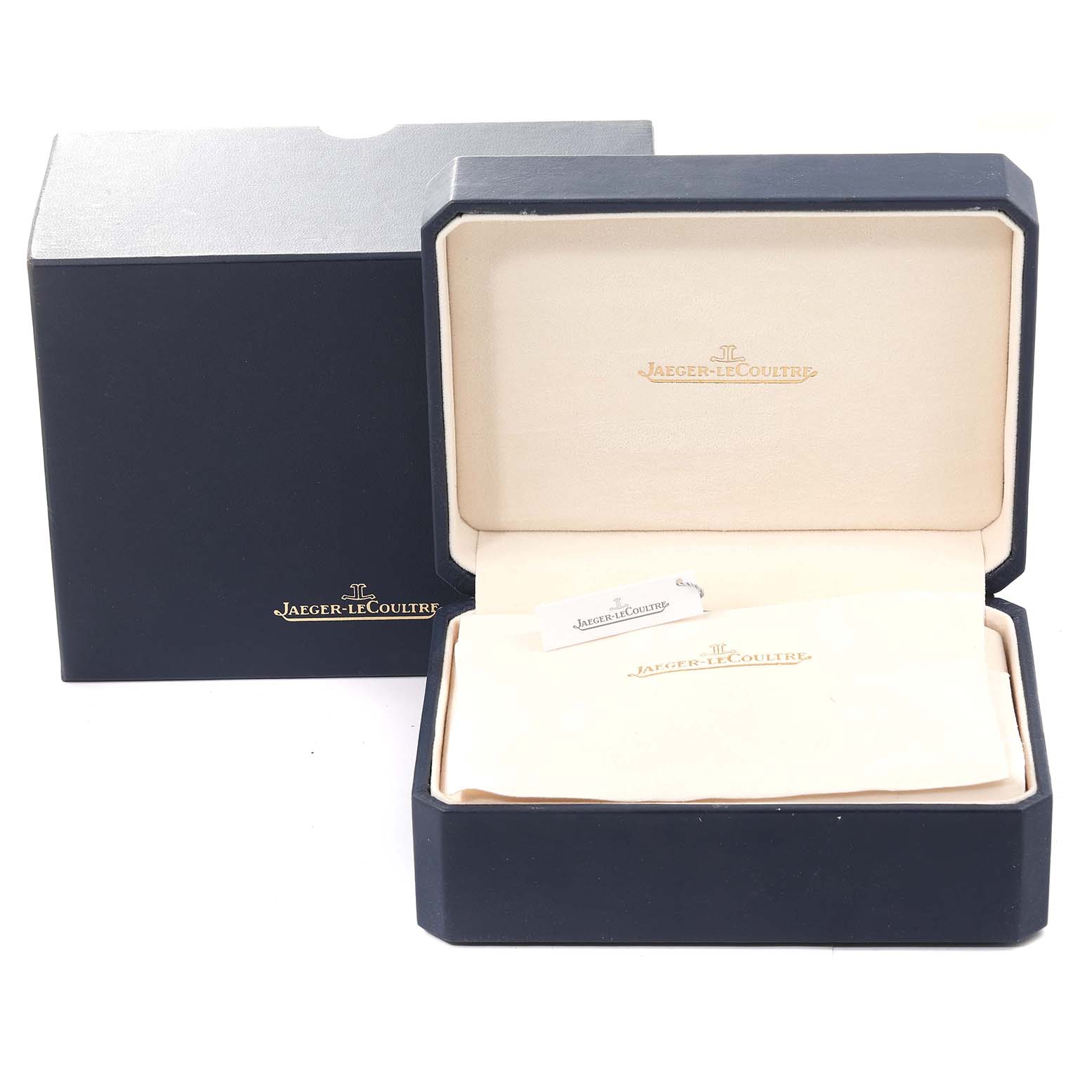 The image shows an open Jaeger-LeCoultre Reverso watch box, with an outer box and a soft inner cover.